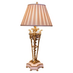 A fine 19th century French Carrera marble and gilt bronze table lamp