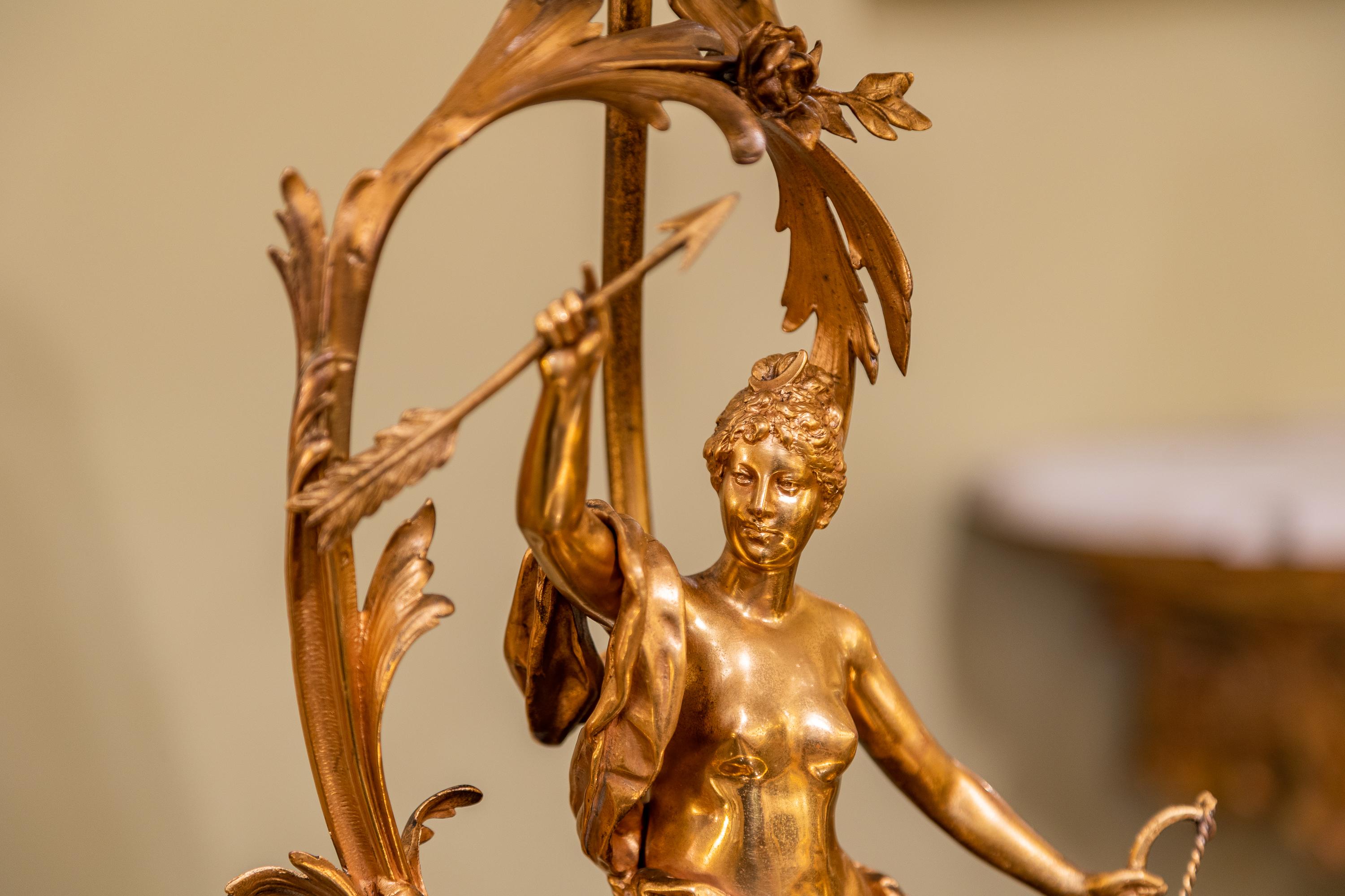 A fine 19th century French Louis XV gilt bronze figural lamp of a female warrior. Possibly Diana Goddess of the hunt. Signed Moreau