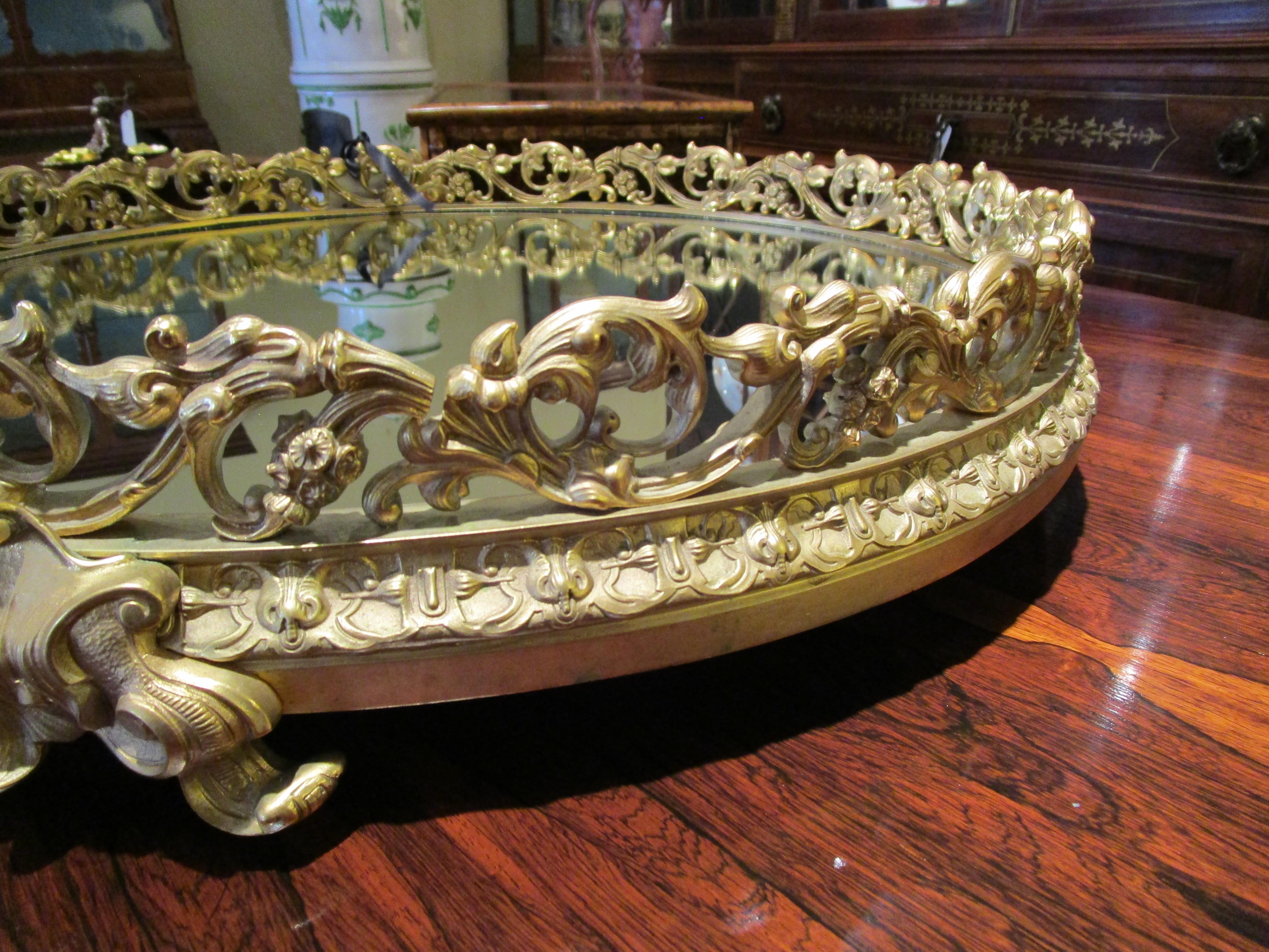 A very fine 19th century French gilt bronze mirrored plateau . Heavy gilt bronze detail . Finest chasing with the original gilt bronze .