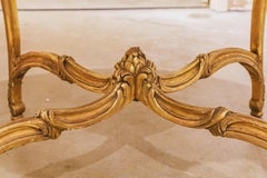 A fine 19th century French Louis XV carved and gilt marble top center table