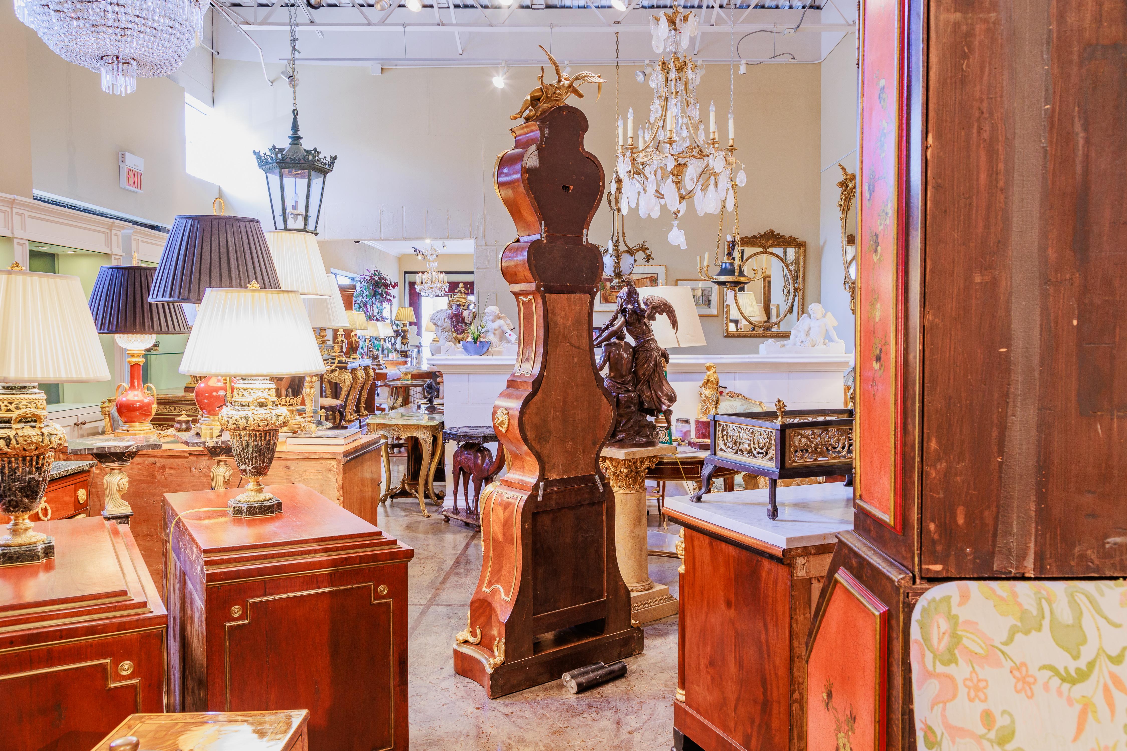 A very fine 19th century French Louis XV gilt bronze mounted grandfather clock . Father time atop the bonnet. Gilt bronze lion mounts . The clock in working order . Mahogany with fine casting gilt bronze details . 