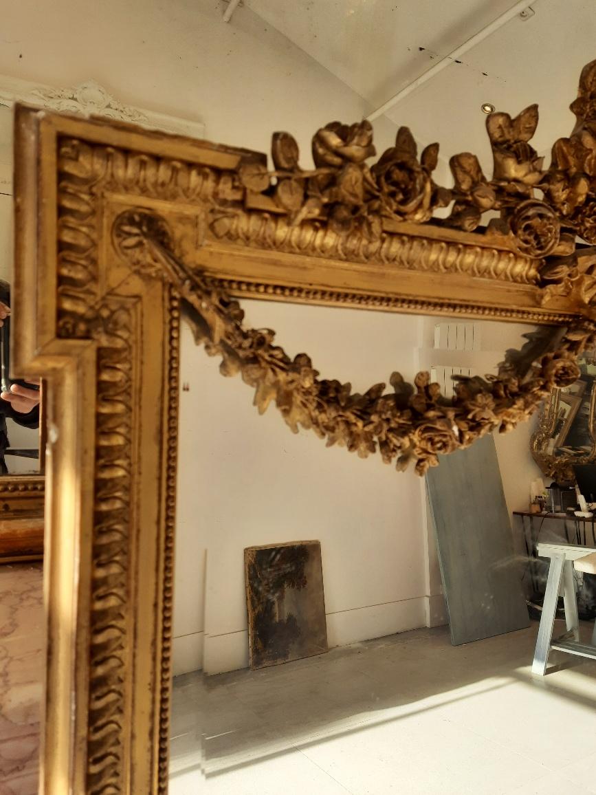 A fine 19th century gilt carved Louis XVI mantle mirror.