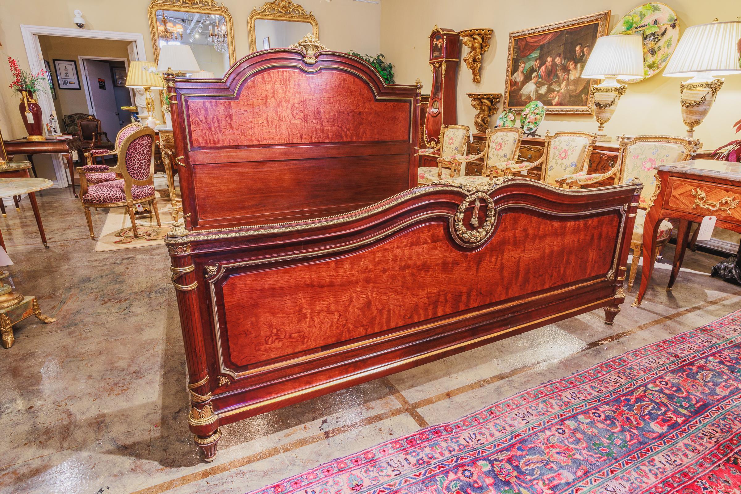 A fine 19th century French Louis XVI mahogany and gilt bronze mounted King Size bed. Fine gilt bronze mounts.