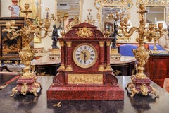 A fine 19th century French red marble and gilt bronze clock set
