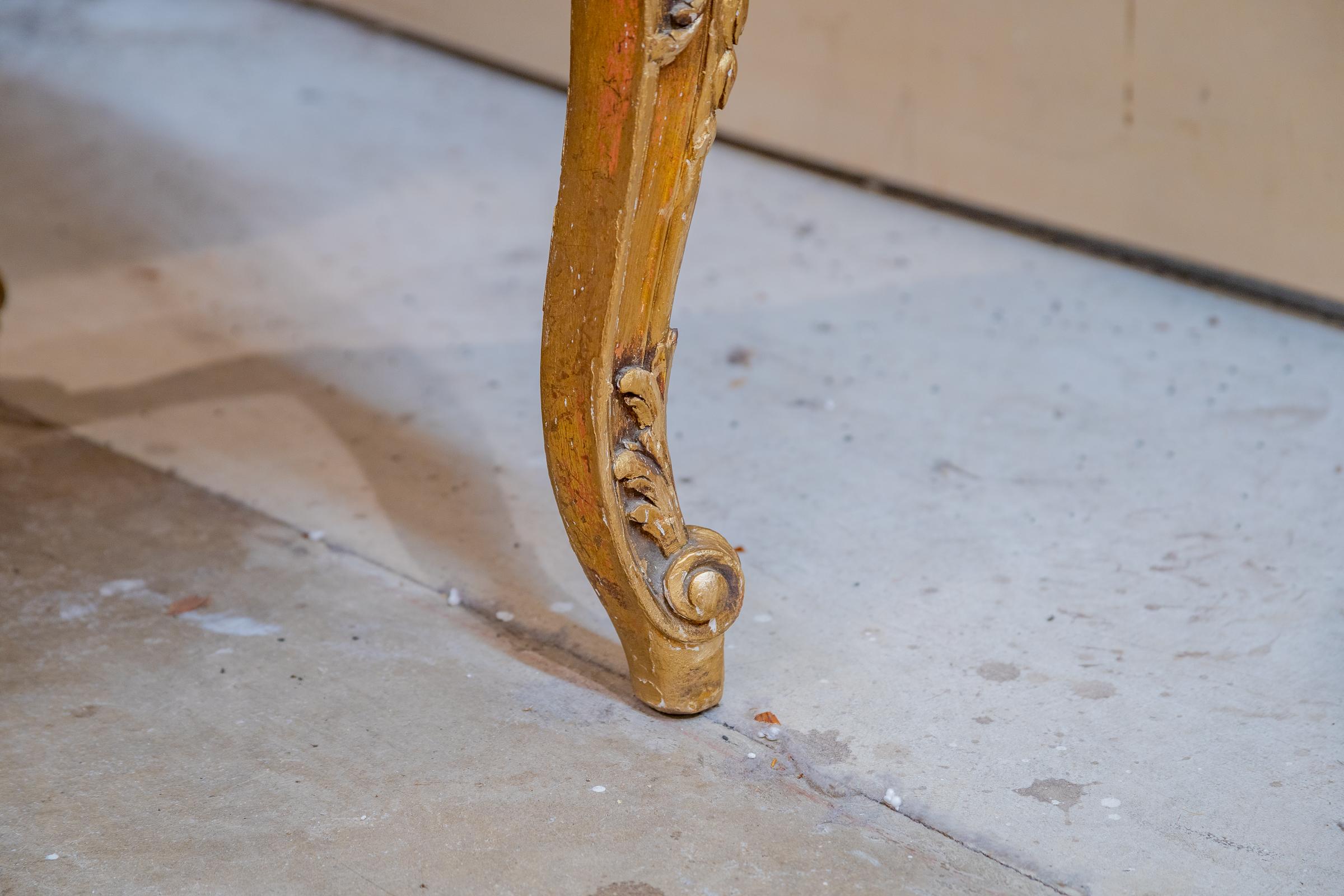 A fine 19th century French Regence hand carved and gilt bench.