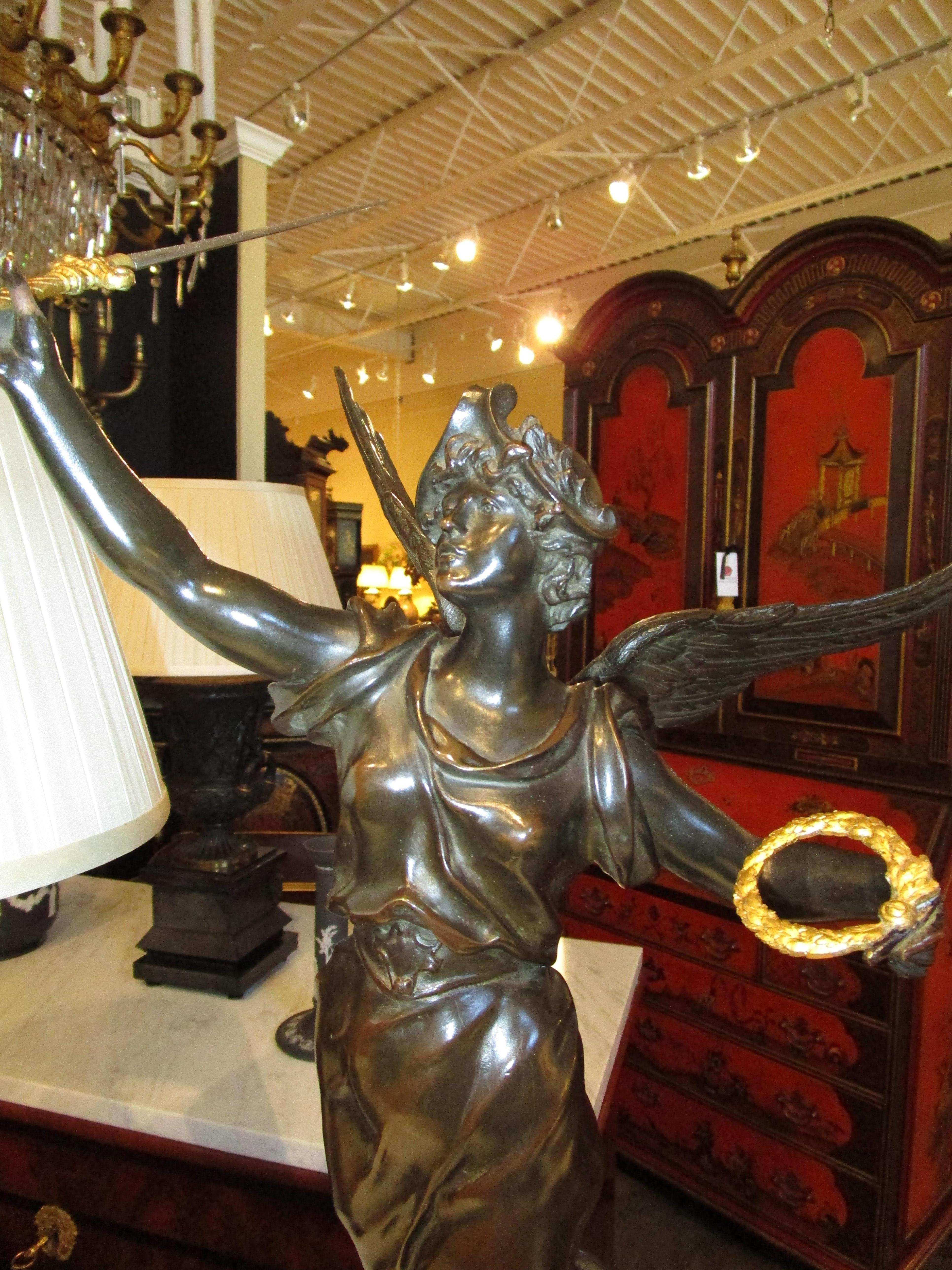 A fine 19th century French signed bronze of Victory. Parcel gilt details . In Good Condition For Sale In Dallas, TX