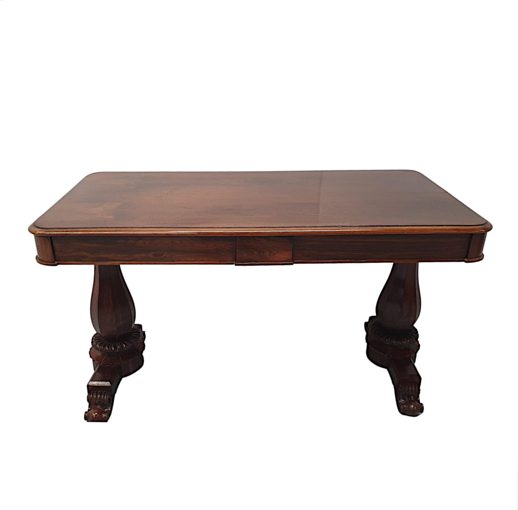 A fine 19th century Irish fruitwood library table in the manner of Williams and Gibton, fabulously hand carved with gorgeously rich patination and grain. The moulded top of rectangular form with curved corners raised over simple frieze with roundel