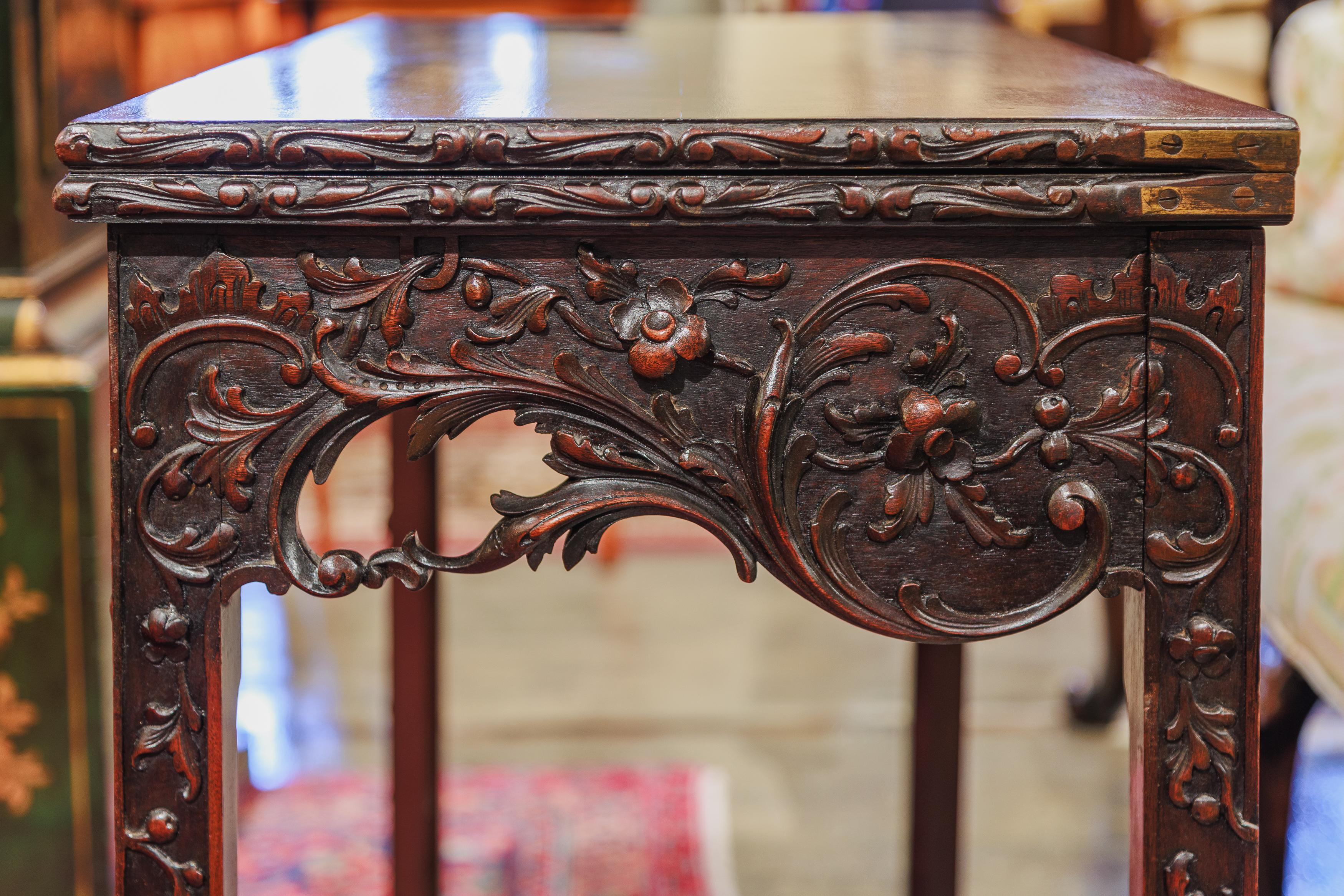 A fine 19th century mahogany Chinese Chippendale games table .  1