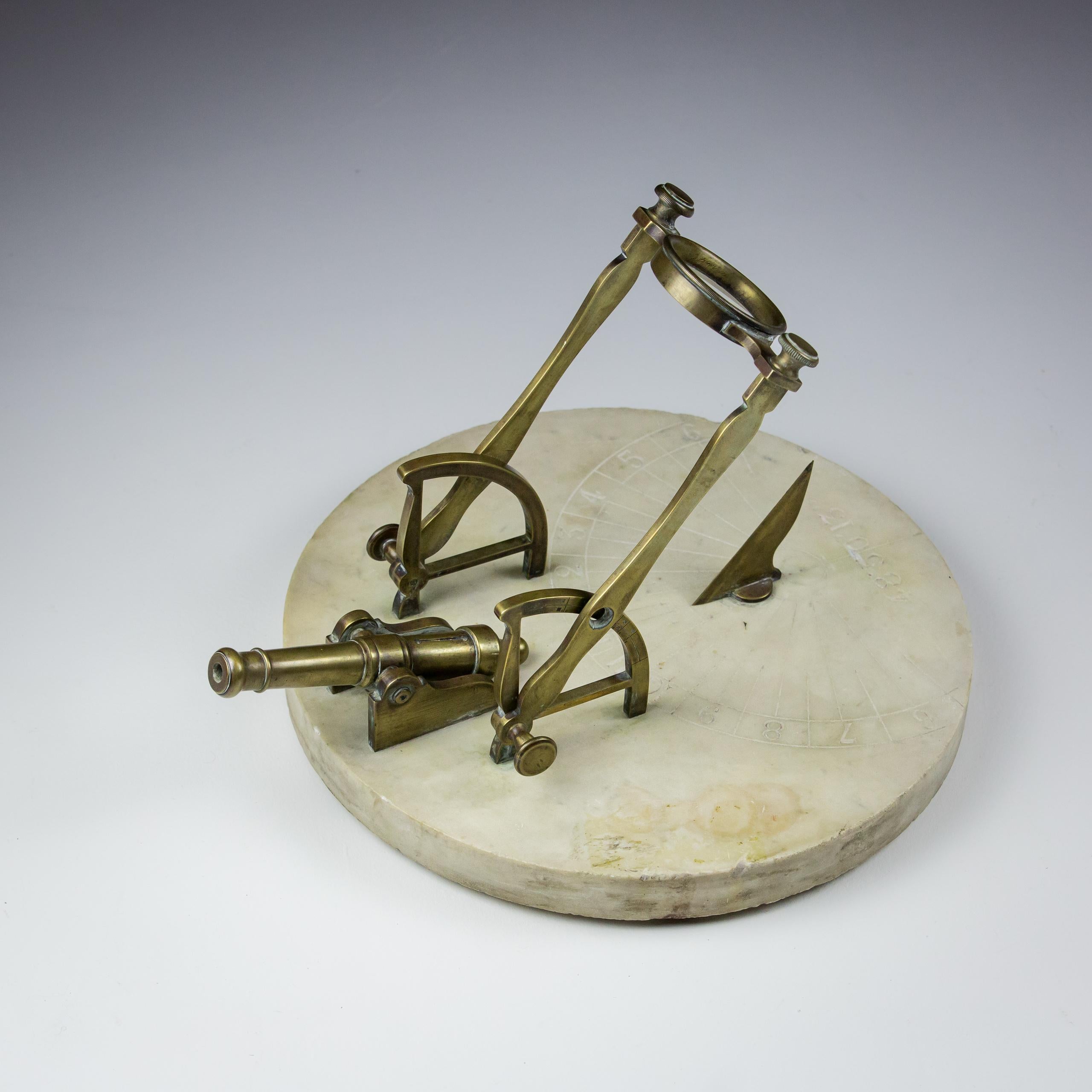 
A Fine 19th Century Meridian or Noon Cannon, Large Marble Base into which is carved a sundial with a bronze Gnomen, also engraved is the operational latitude 48 50 13'. Mounted cannon with overhanging adjustable lense. The idea being the cannon is