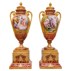 A fine 19th century pair of Royal Viennese lidded urns signed Kaufman