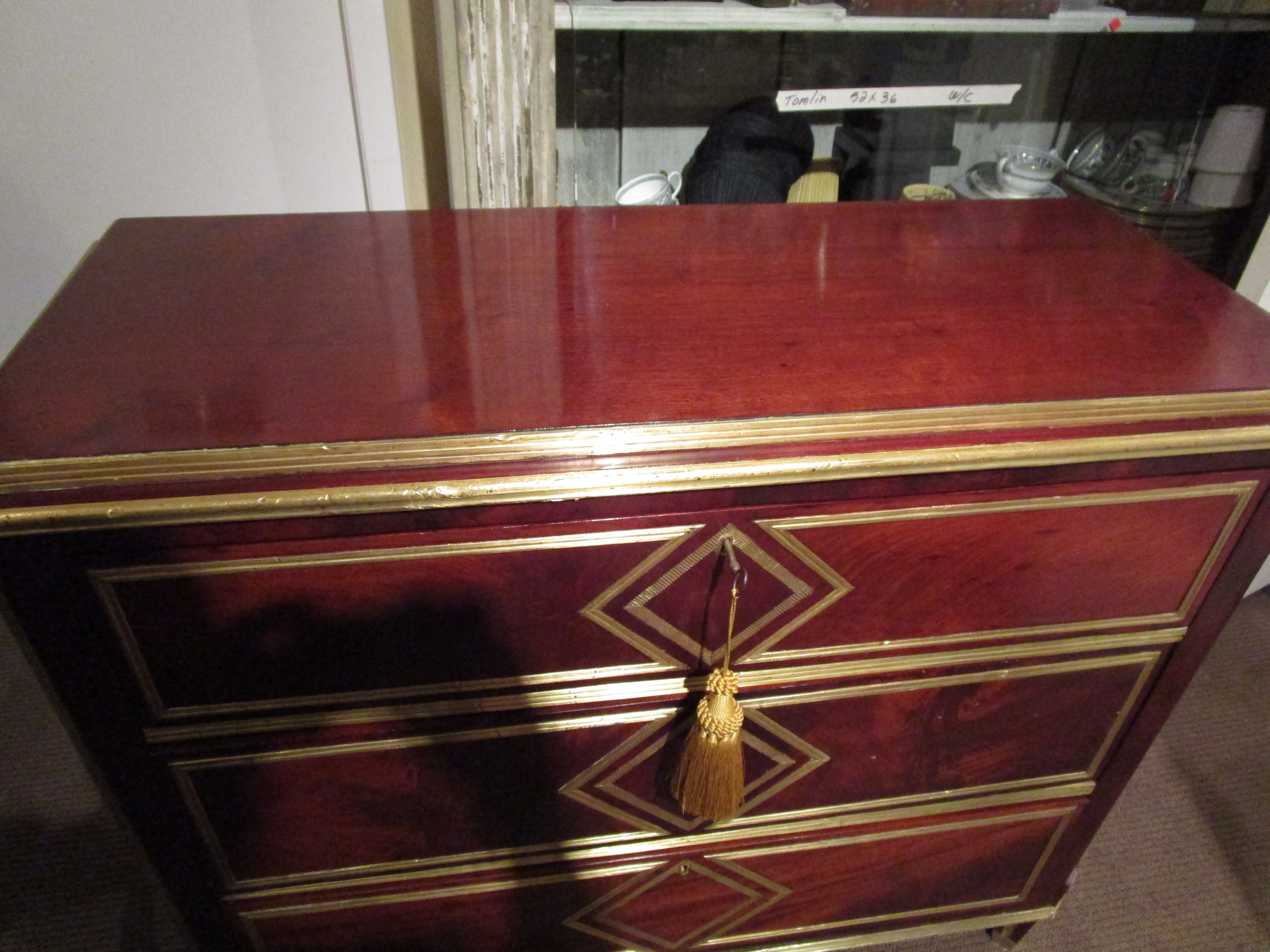 A fine 19th century Russian mahogany and hand hammered brass inlayed commode. All original.