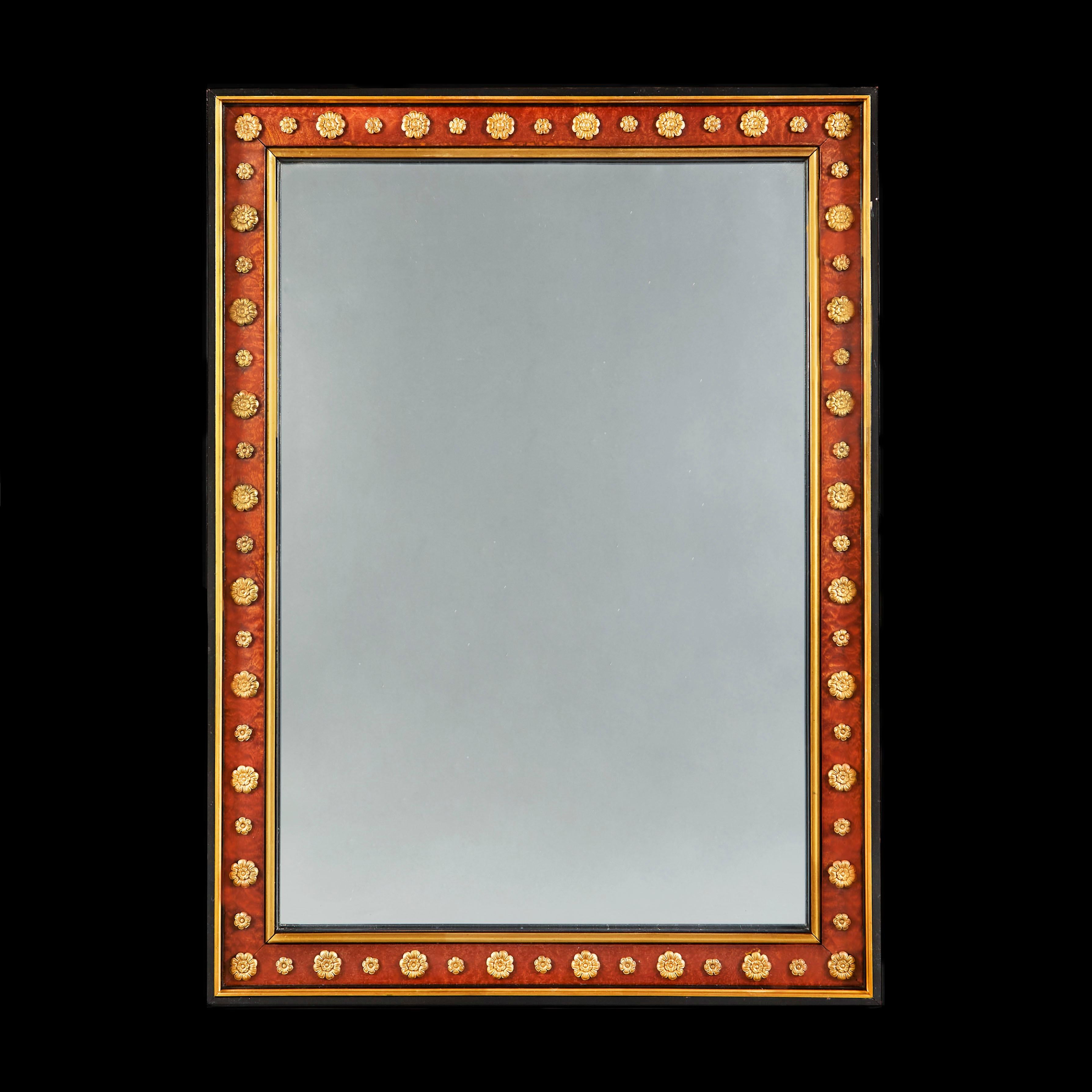 A fine nineteenth century Russian mirror, with burr wood border decorated with ormolu paterae, all set within an ebonised frame.