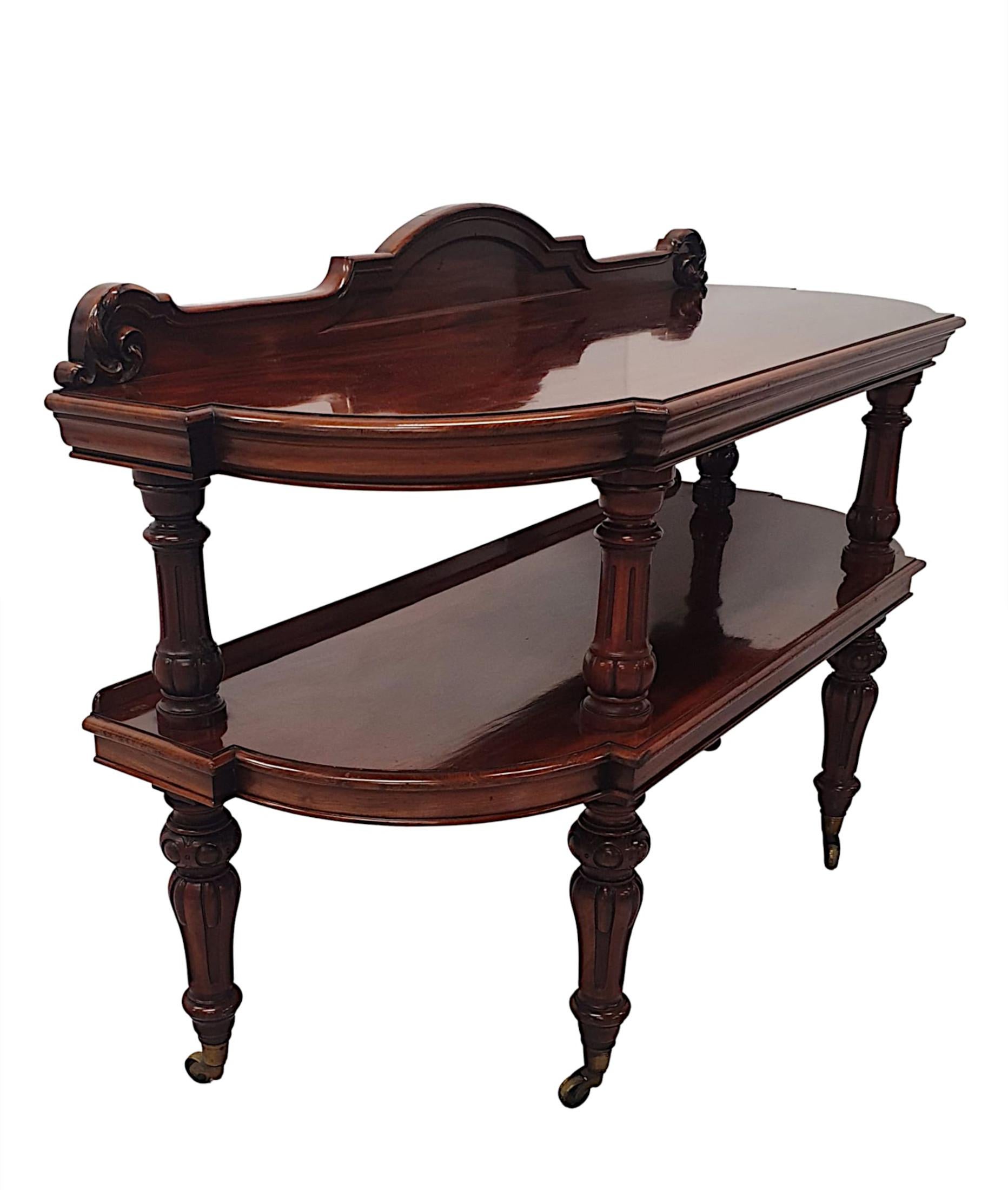 A very fine 19th Century mahogany side or serving table in the manner of Gillows of Lancaster and London. Stunningly hand carved with rich patination, the shaped and moulded top with curved gallery back rail with foliate motif detail, raised above