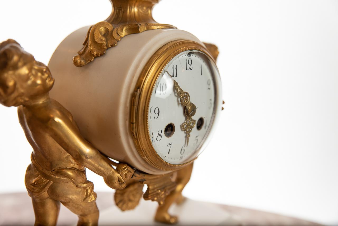 A splendid 8 day, with half & full hour striking on a bell Ormolu clock of cherubs on a white marble base. The movement signed by Mouein of Paris, circa 1885, with sun burst pendulum.
Hard to find this type of clock in such good condition.