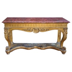 A fine and large giltwood Italian console or game table/ Table à Gibier