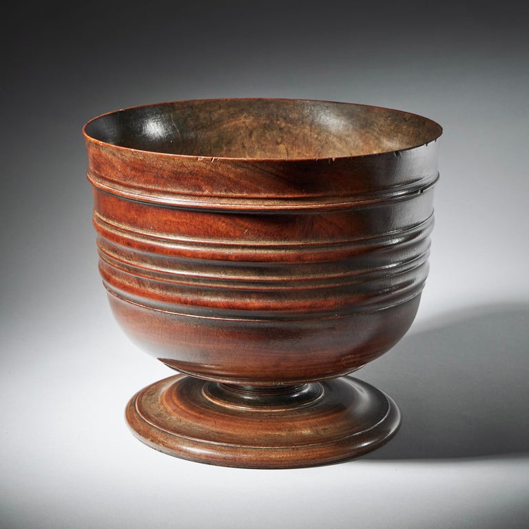 A rare 17th century turned lignum vitae wassail bowl, circa 1660-1680. England.