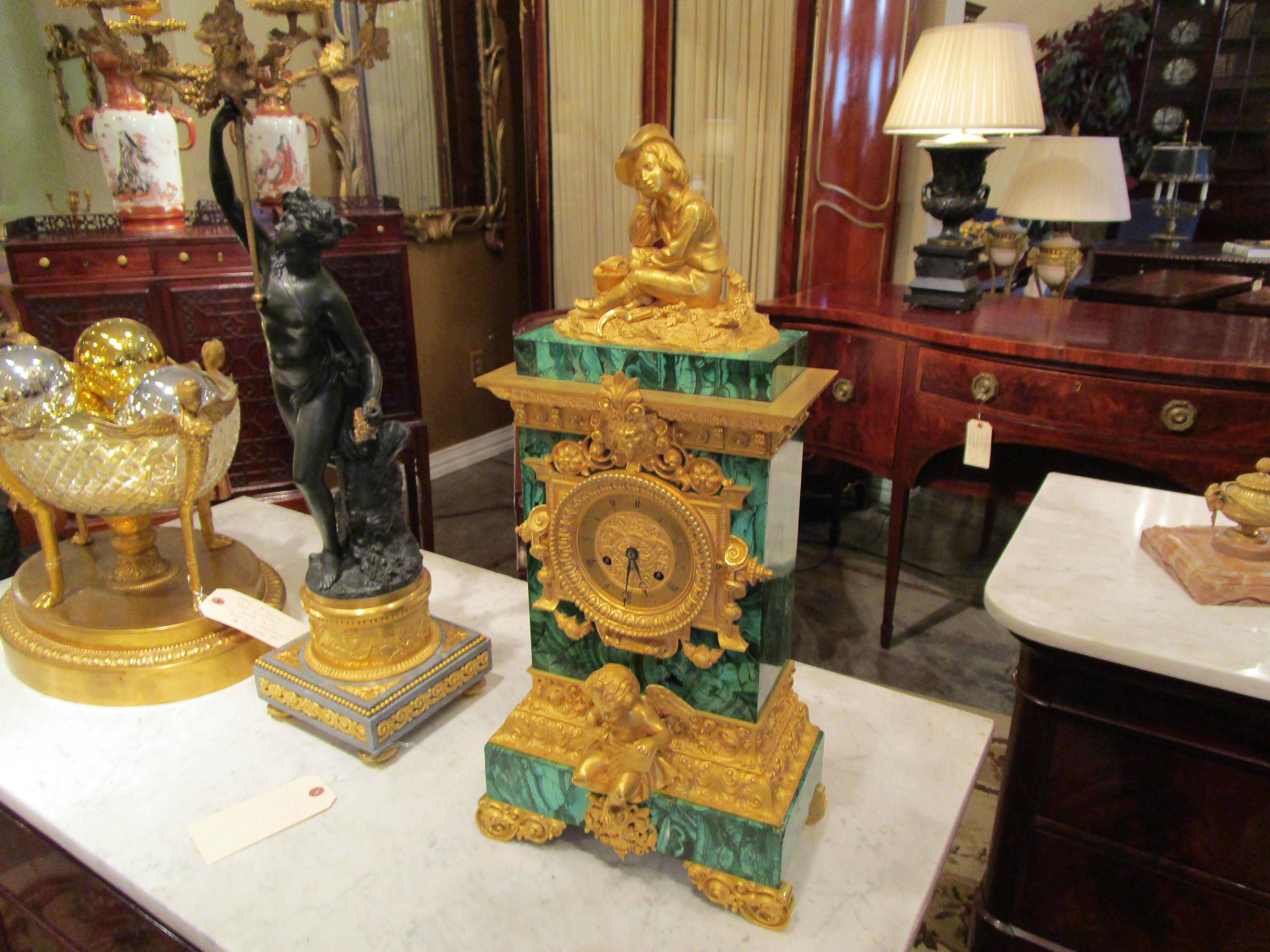 A very fine and rare late 19th century French or Russian malachite and mercury gilt bronze mantle clock 