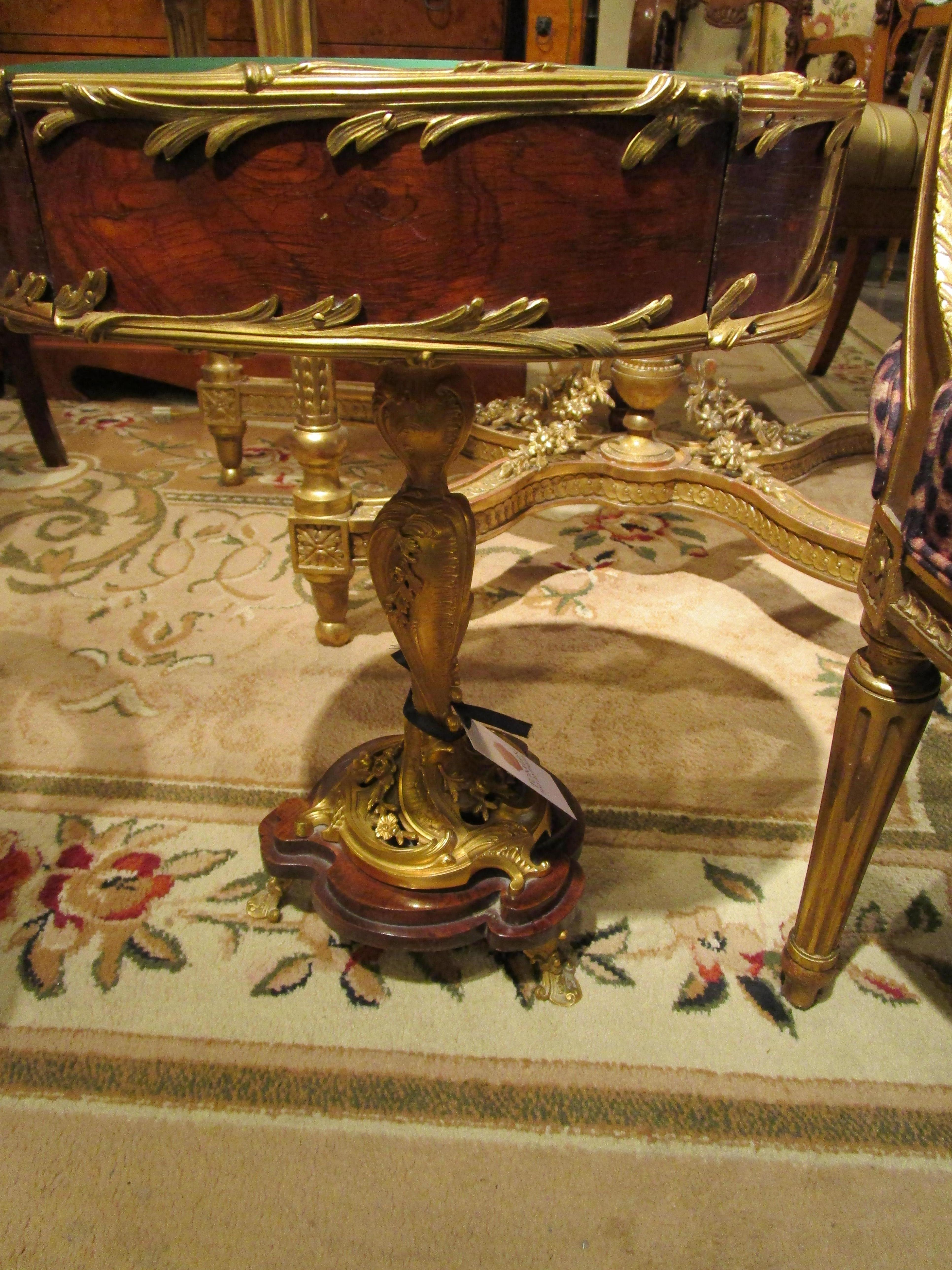 A fine and rare small jewel like 19th century mahogany and gilt bronze mounted vitrine table attributed to Francois Linke . The finest gilt bronze mounts and stem base. Velvet lined.