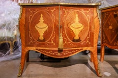 A  fine and rare pair of 19th c George 111 tulipwood and marquetry commodes.