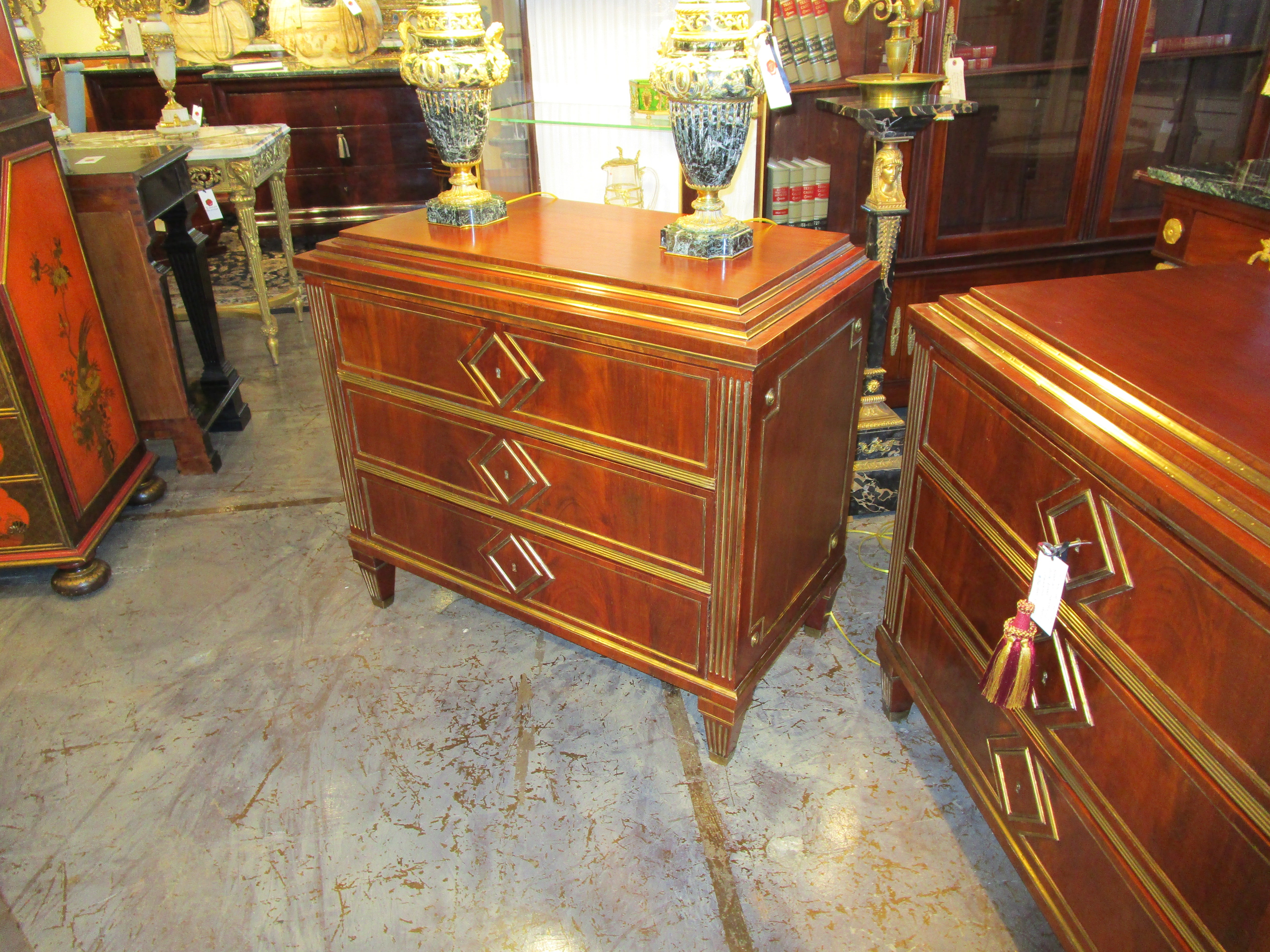 A fine and rare pair of 19th century Russian mahogany and inlayed brass commodes For Sale