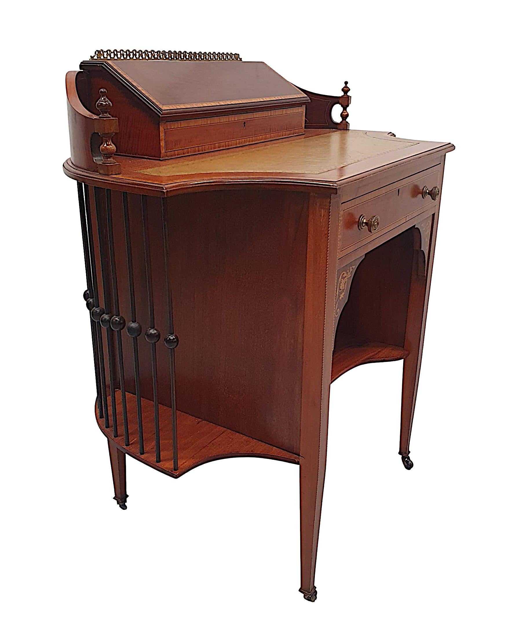 A fine and unusual Edwardian mahogany ladies leather top desk, with gorgeously rich patination and grain. Line inlaid, cross banded and with exquisite marquetry detail, depicting scrolling foliate and flowerhead motif detail throughout. The moulded