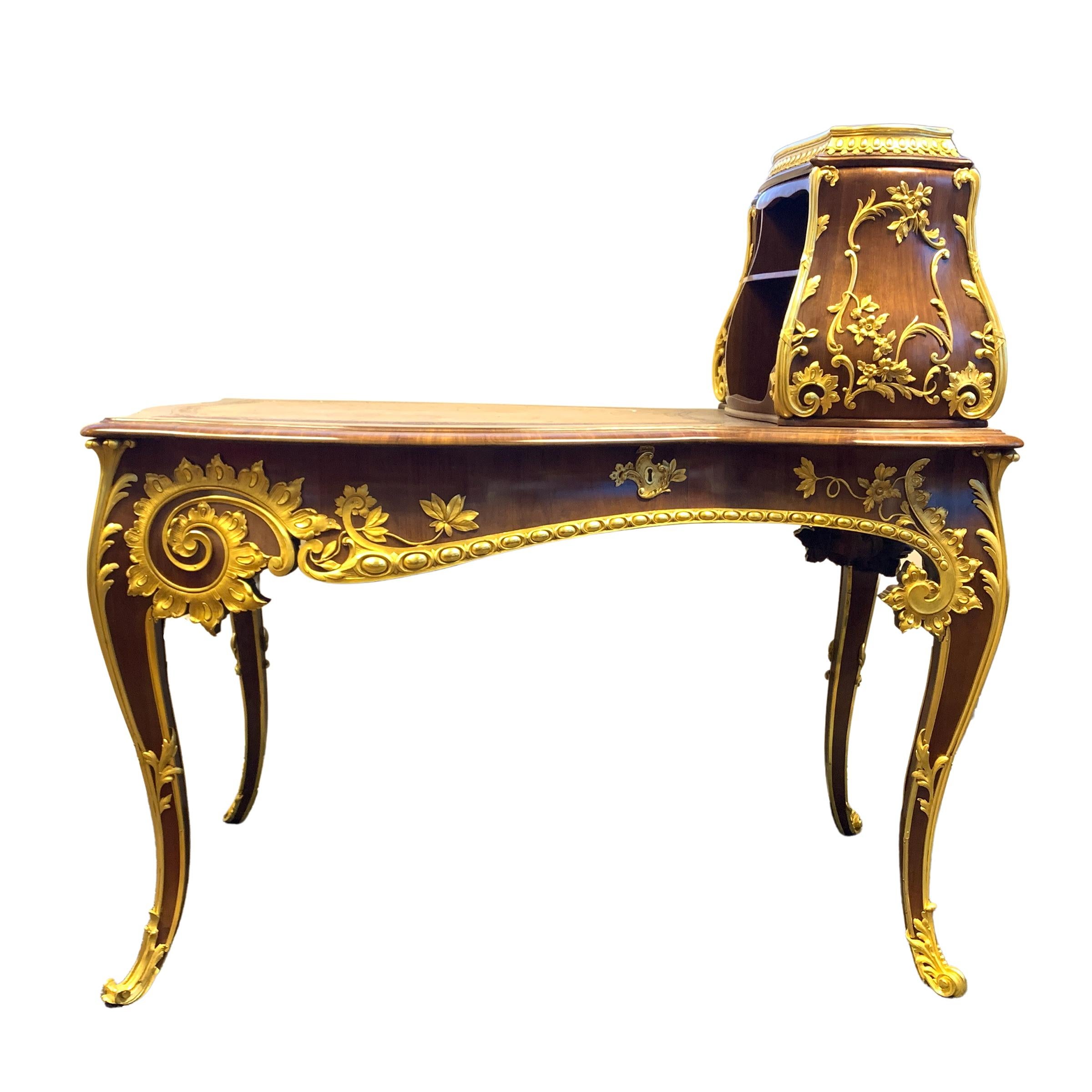 Exquisite quality wood and bronze inlaid desk with shelfs.
  