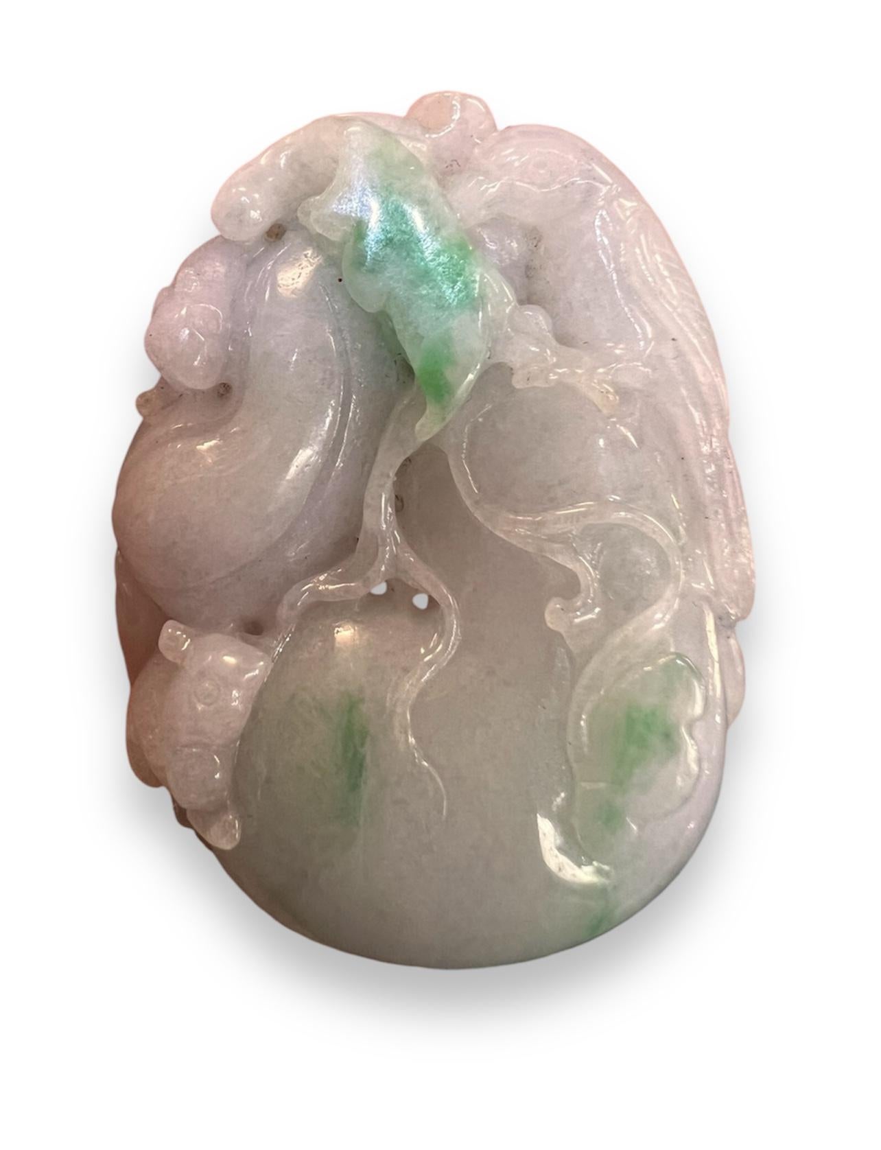 A Fine Chinese jade jadeite toggle pendant of a fruit finely carved in relief with a bird and squirrel from the white jade jadeite stone with green inclusions .


Very nicely polished. A good quality stone.


19/20th C


Size 5.5 x 4 cm.


Very good
