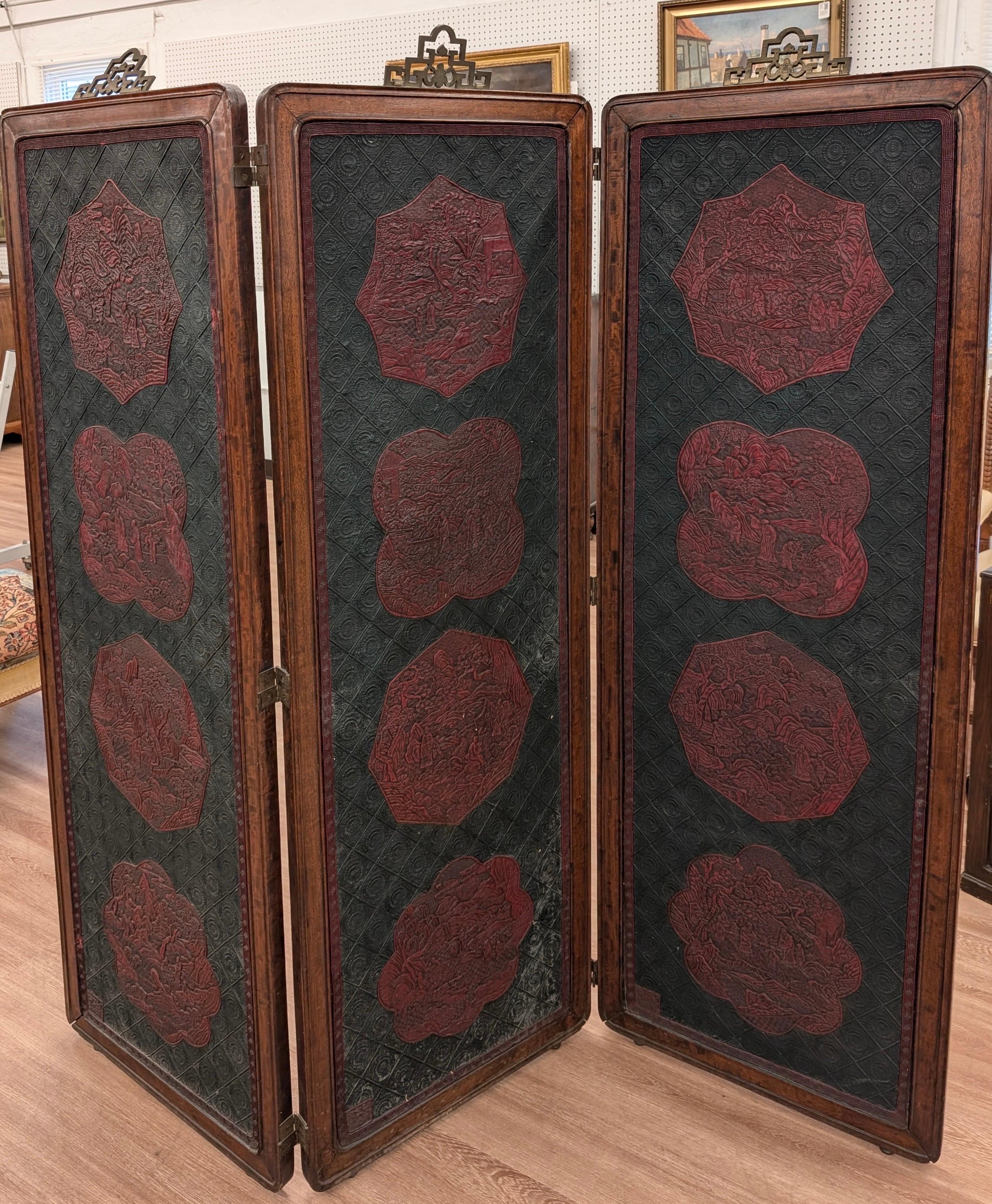 A chinese lacquer and hardwood folding scree.  Three panels measuring 64 inches high, and 22 inches wide, total width is 66