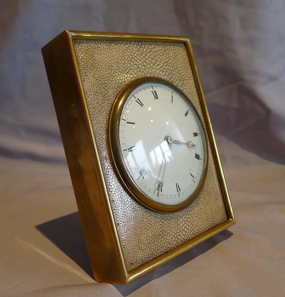 A fine antique English shagreen and gilt bronze strut clock. A very smart and chic clock with a lovely convex enamel white dial with Roman hour numerals in black with a gilt bronze bezel and fine gilt moon hands. The dial beautifully clear for easy