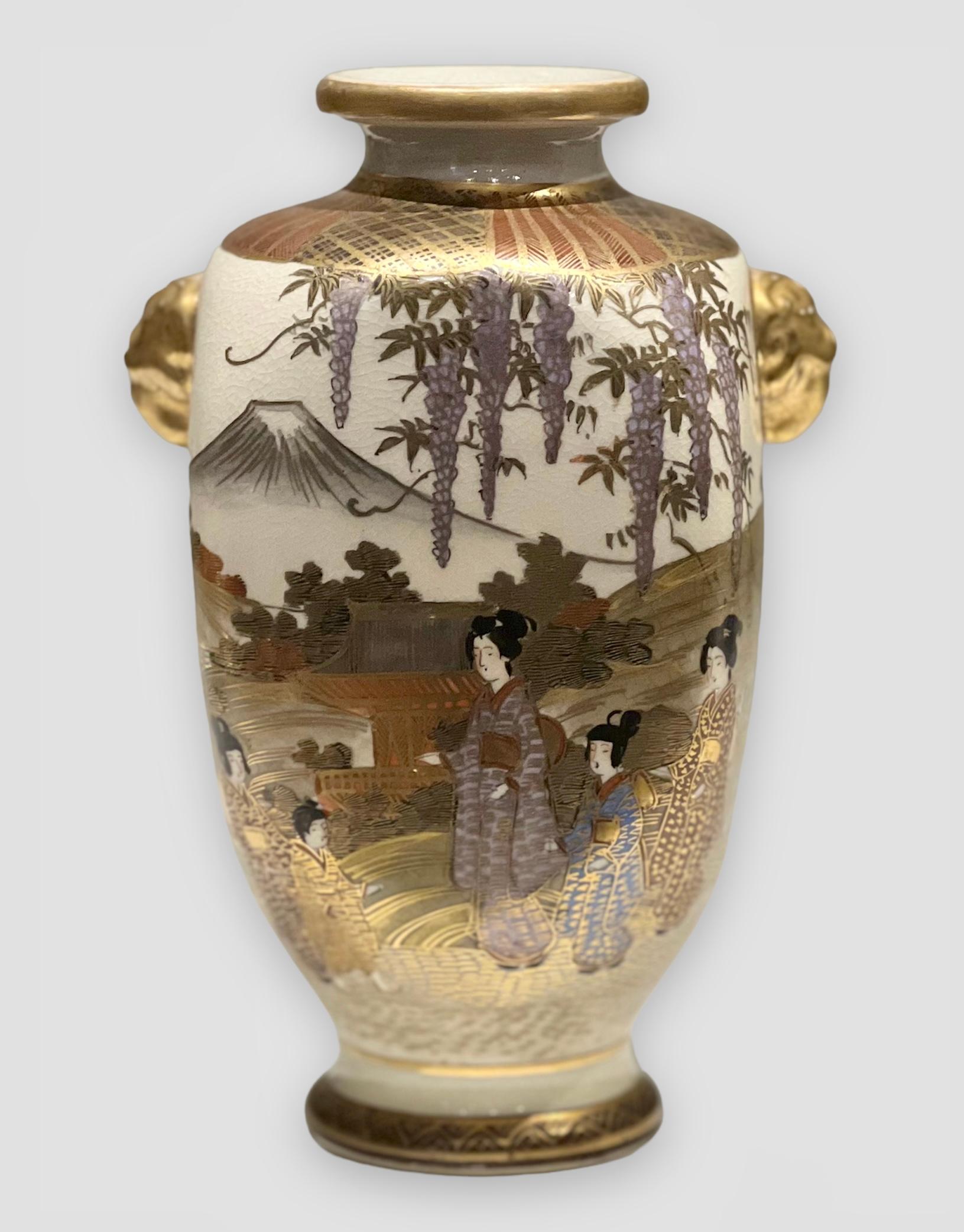 A fine and elegant antique Japanese Satsuma vase. Meiji period. Signed


A Japanese Satsuma earthenware four sided vase painted and gilt with maidens and children in a lakeside setting with blossoming trees, pavilions and mountains beyond