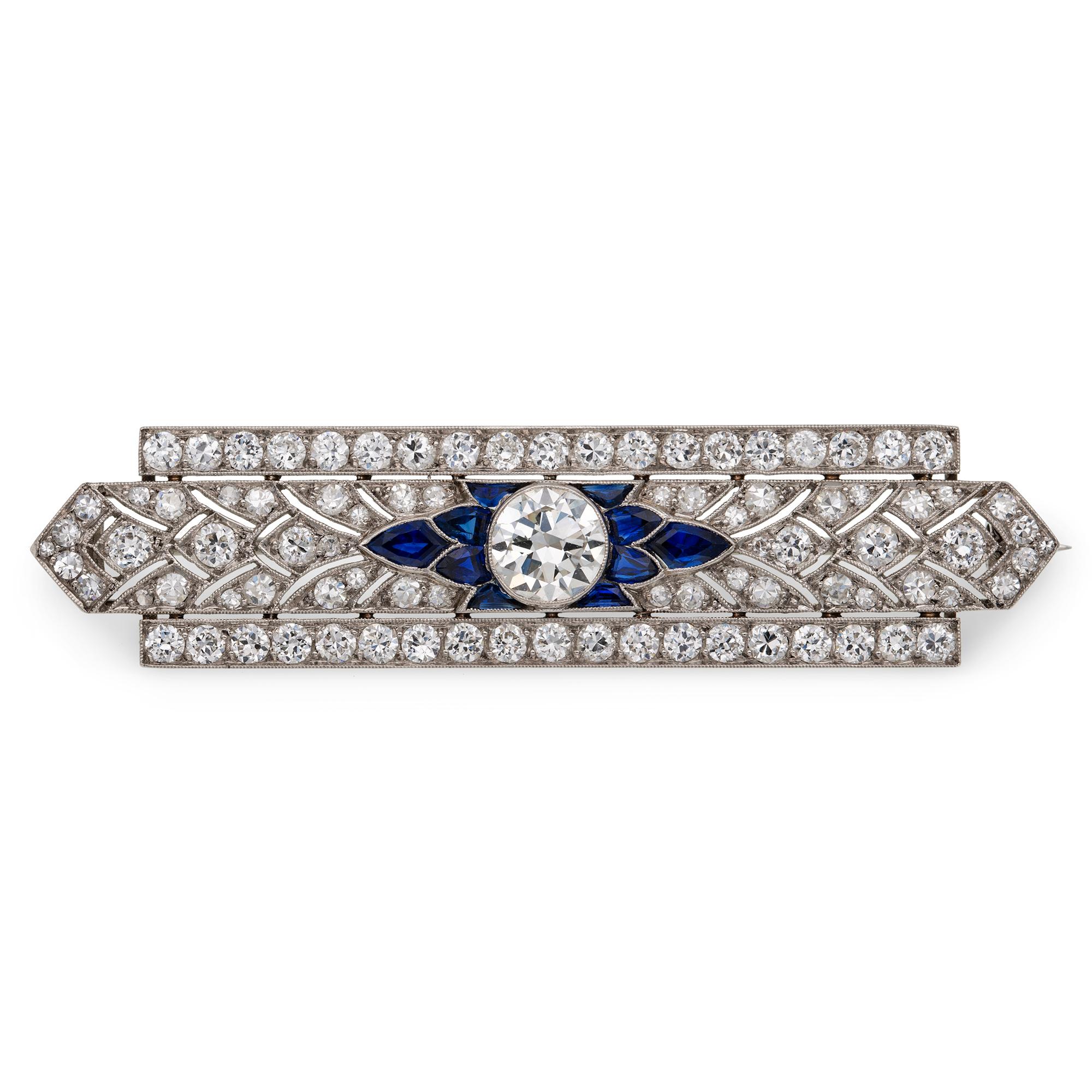 A fine Art Deco diamond and sapphire bar brooch, to the centre a transitional brilliant-cut diamond estimated to weigh 1.75 carats, assessed colour H-I, assessed clarity VS1-2, set between five fancy-cut sapphires on each side, to an openwork