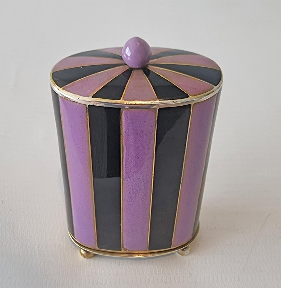 A highly unusual and rare Art Deco miniature silver and purple and black enamel travel our boudoir clock by Juvenia. Juvenia is a Swiss luxury watch manufacturer, founded in 1860 in Saint-Imier, Switzerland by Jacques Didisheim. The brand is known