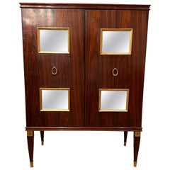 A fine bar cabinet by Paolo Buffa with mirrored panels