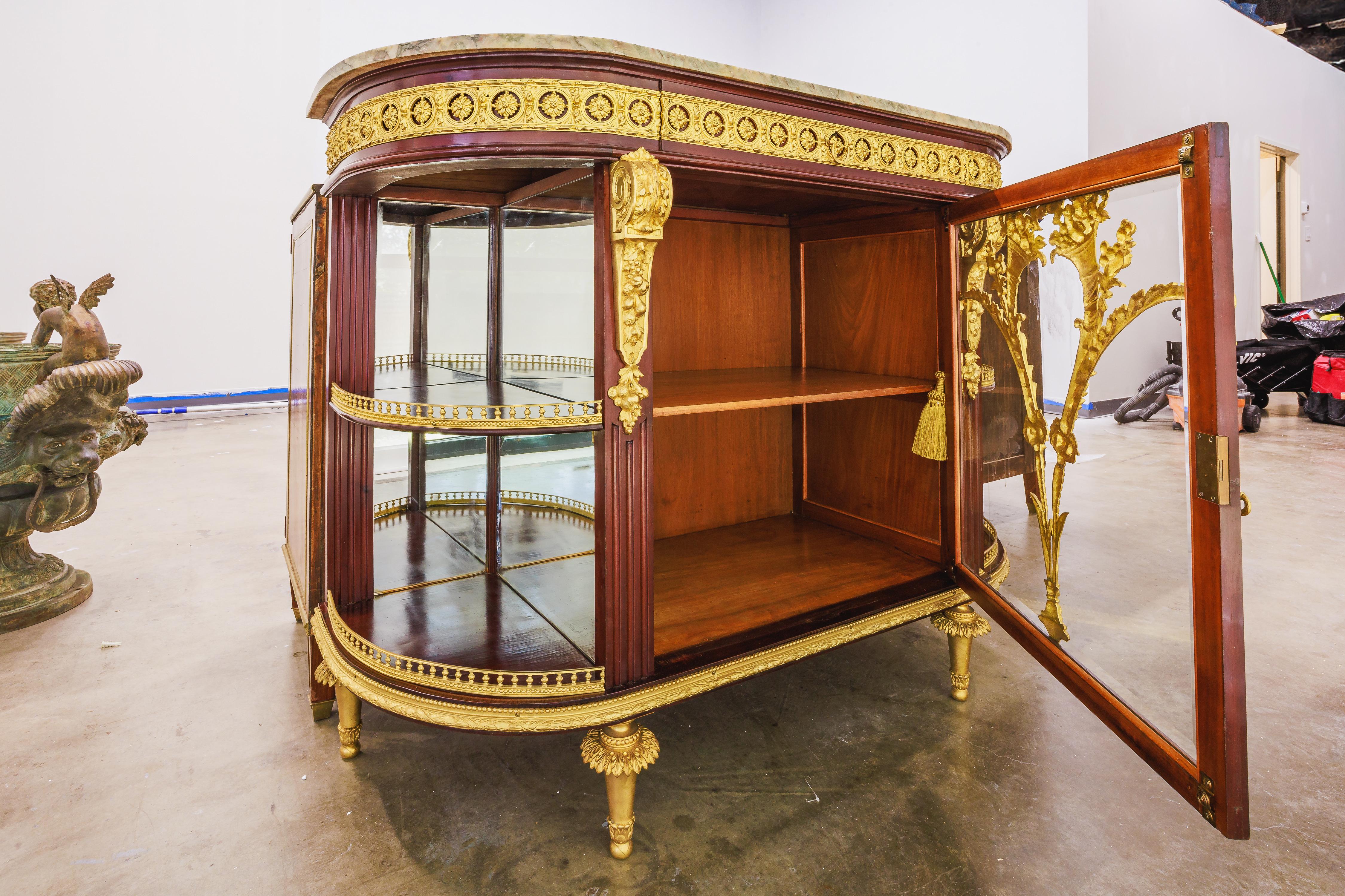 A very fine 19th century French Belle Epoque mahogany and gilt bronze mounted display cabinet. Original marble top. 