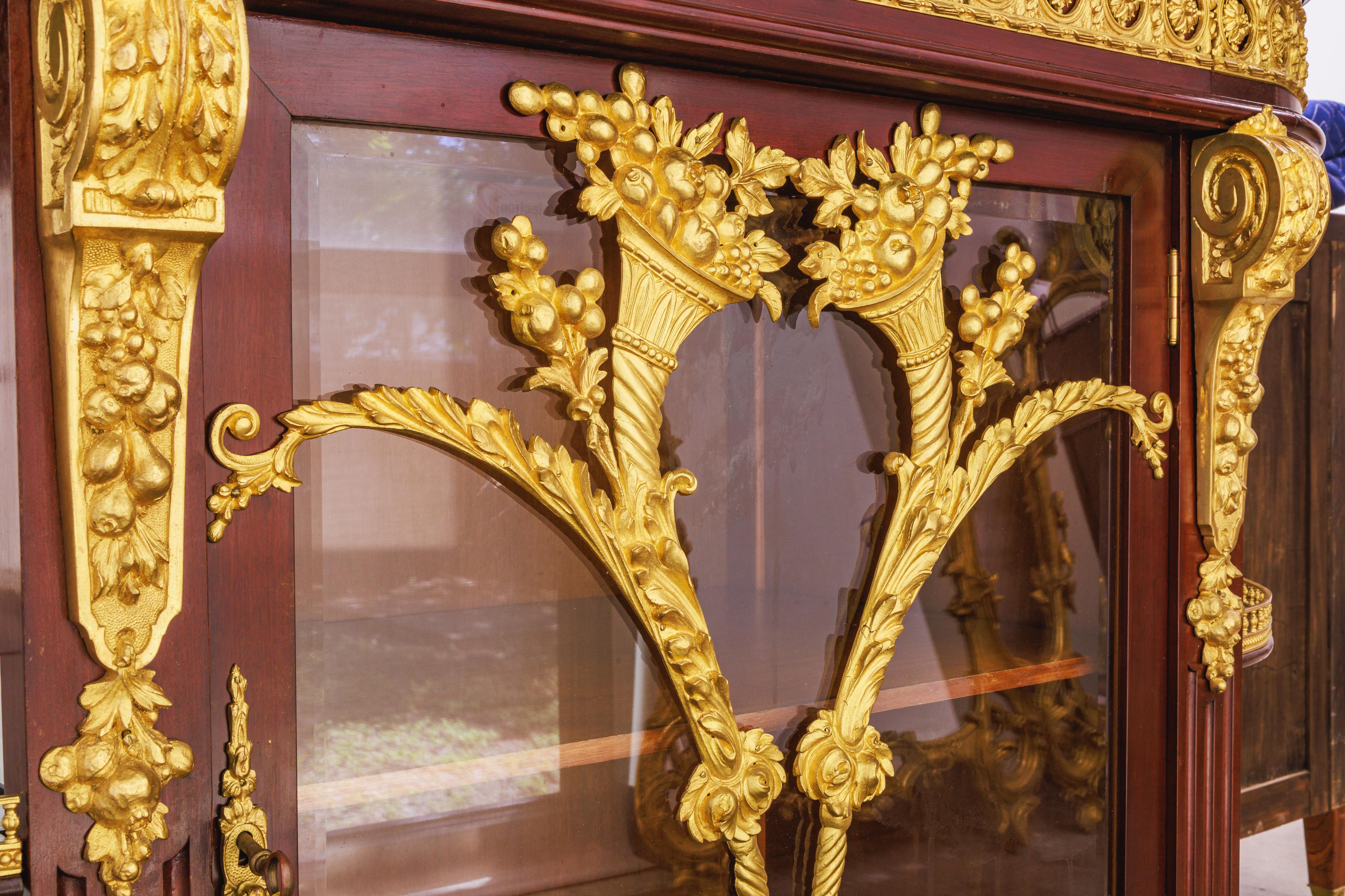 Bronze A fine Belle Epoque  mahogany and gilt bronze mounted display cabinet . For Sale