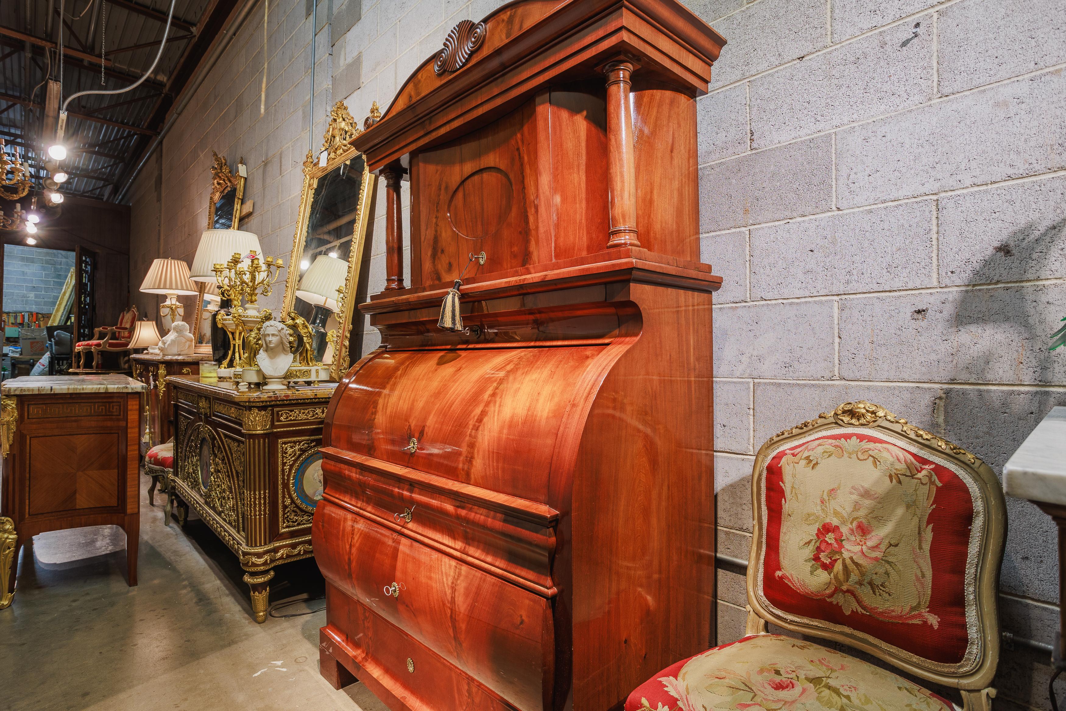 A very fine and rare Biedermeier walnut roll top secretary . Fine satinwood inlay . French polished and ready to place. Several drawers and compartments for storage .