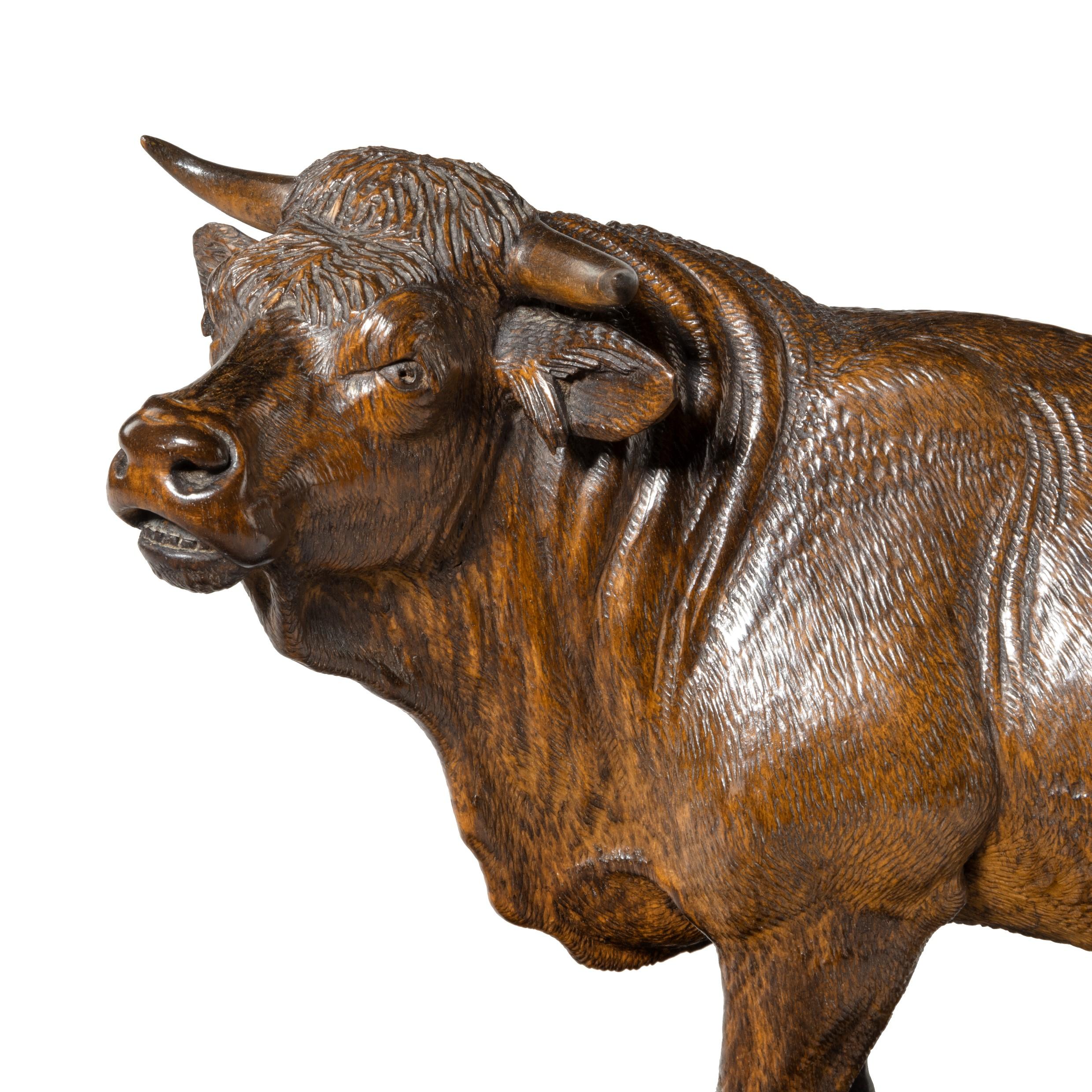 A fine 'Black Forest' linden wood model of a standing bull, Swiss, circa 1890.