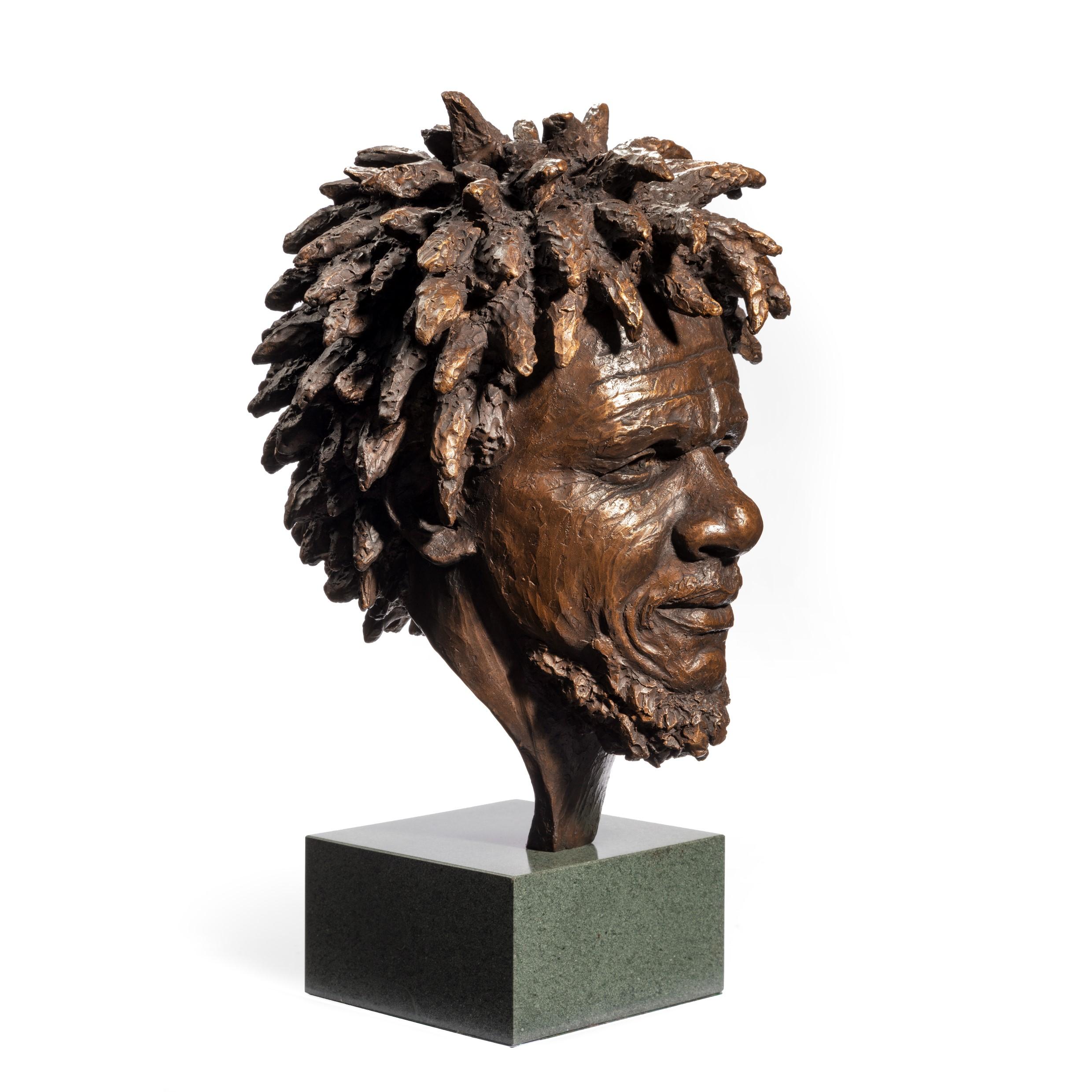 A fine bronze bust of ‘Dougie’ by Vivian Mallock depicting the head and smiling face of a Vincentian calypso singer with a dark patination becoming lighter at the end of his dreadlocks. Signed, 2/9. English, 2000.