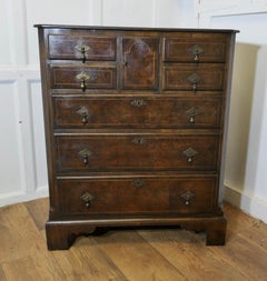 A Fine Bur Walnut and Oak Chest of Drawers  The chest has can unusual combinatio