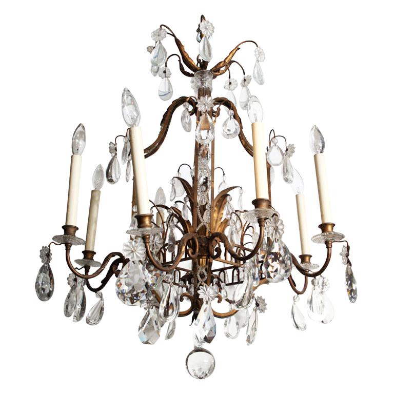 A Fine Cage Form Eight-Light Crystal and Bronze Chandelier