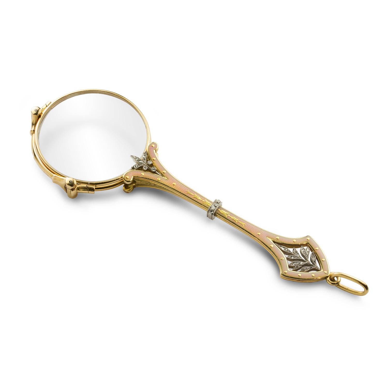 A fine Cartier enamel and gold lorgnette, the lorgnette consisting of two circular lenses each within a yellow gold mount, the handle with exquisite rose enamel engine-turned background embellished with yellow gold floral motifs and double-sided