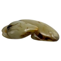 A Fine Carved Jade Toggle in the Form of a Recumbent Dog China, Qing Dynasty
