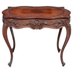 A Fine Carved Turtle Top Parlor Table