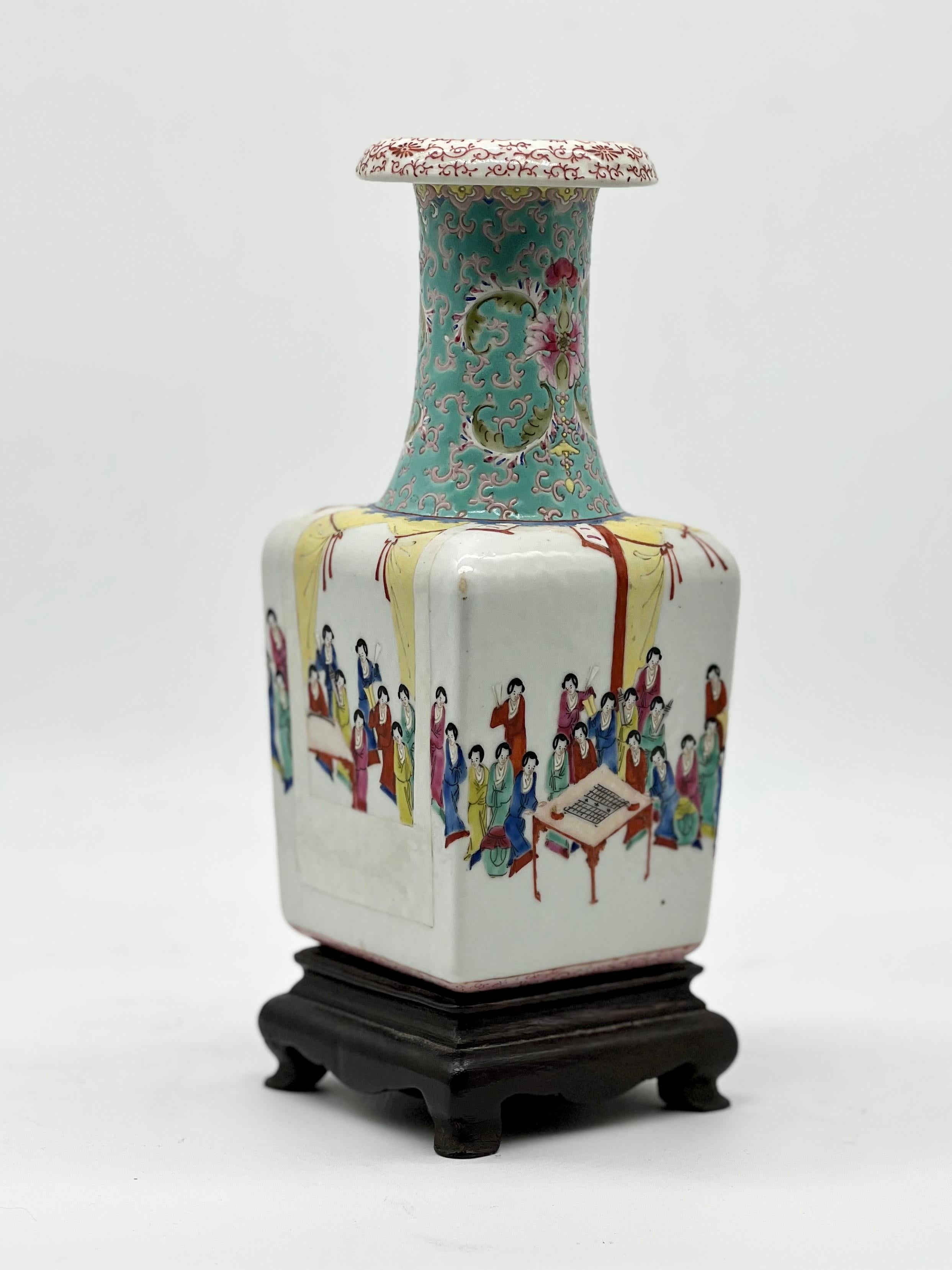 A Fine Chinese famille-rose Vase with women enjoying scholarly pursuits.
Jiaging seal mark. 19th Century.

The square body rising from a short straight foot to a tall waisted neck with a flaring rim, brightly and finely enamelled with women