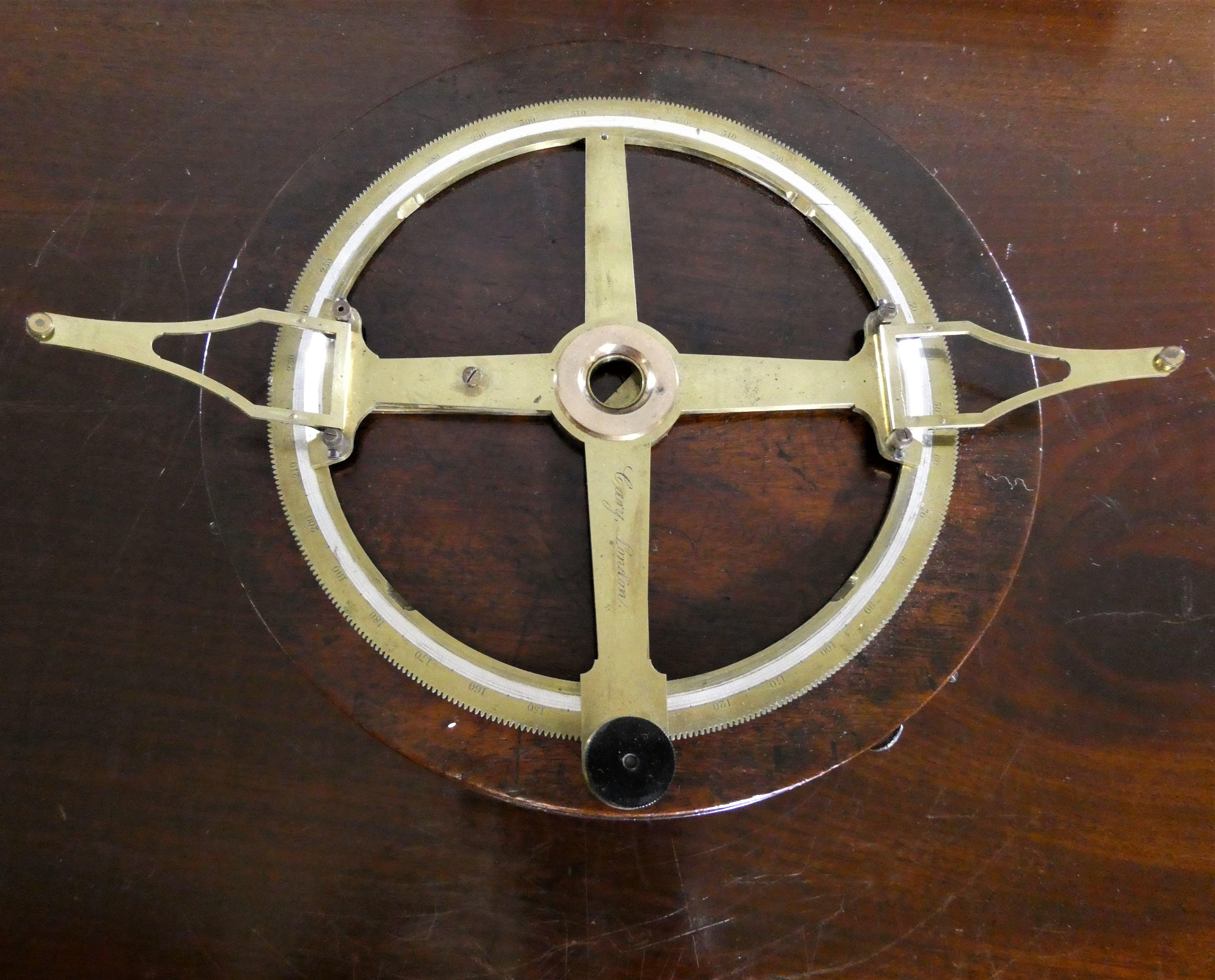 William Cary, London Circular Protractor. C.1810


The protractor with geared knob turn for full diameter bar, double hinged scribe arms with shaped frame. Main wheel with four spokes and glass sight cross centre, full circumference inscribed