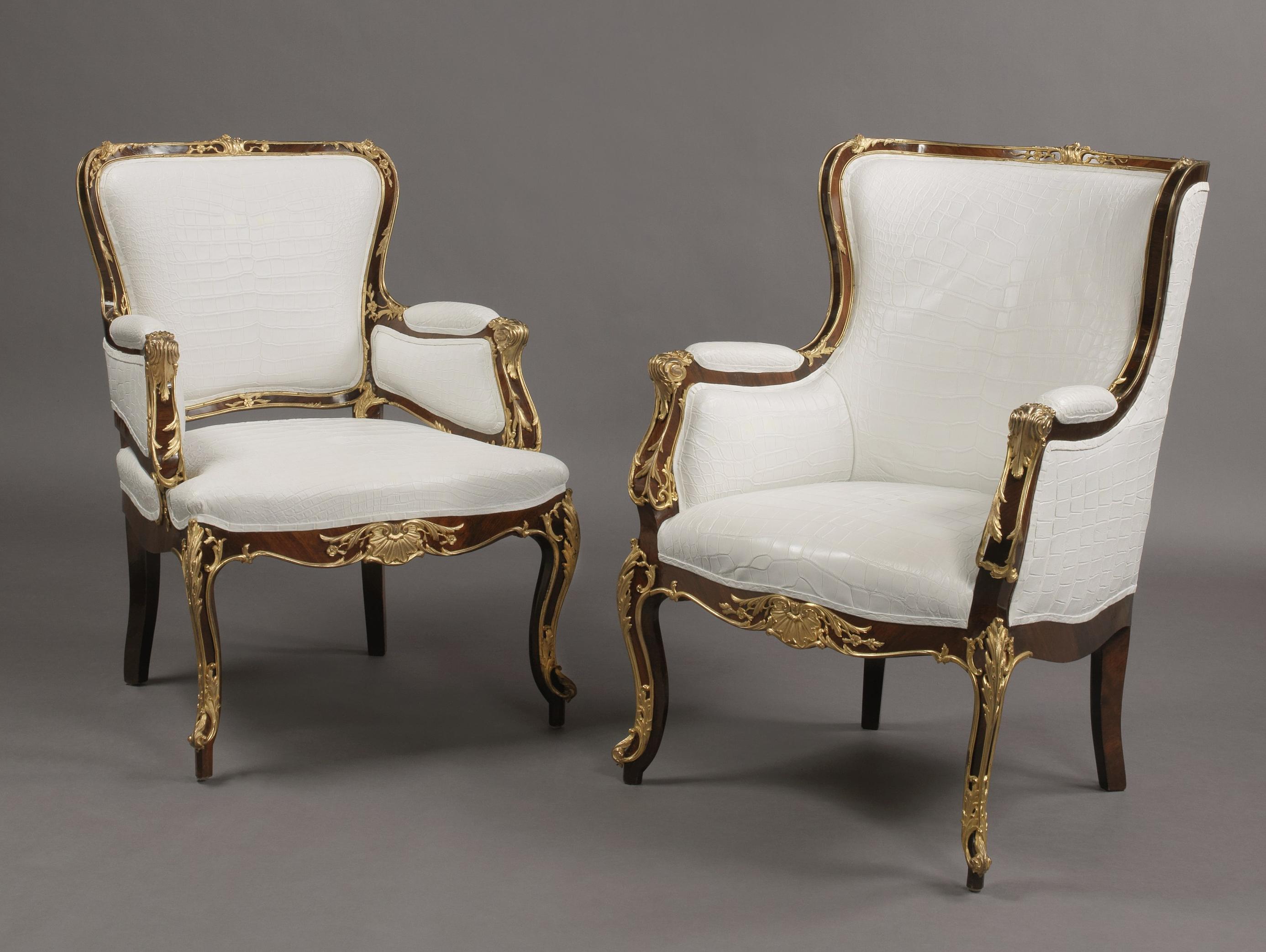 A fine companion pair of Russian gilt bronze-mounted armchairs. 

Russian, circa 1870.

The frame of each chair with exceptional gilt bronze mounts. The padded backs, seats, sides and arms later upholstered in crocodile pattern white leather.