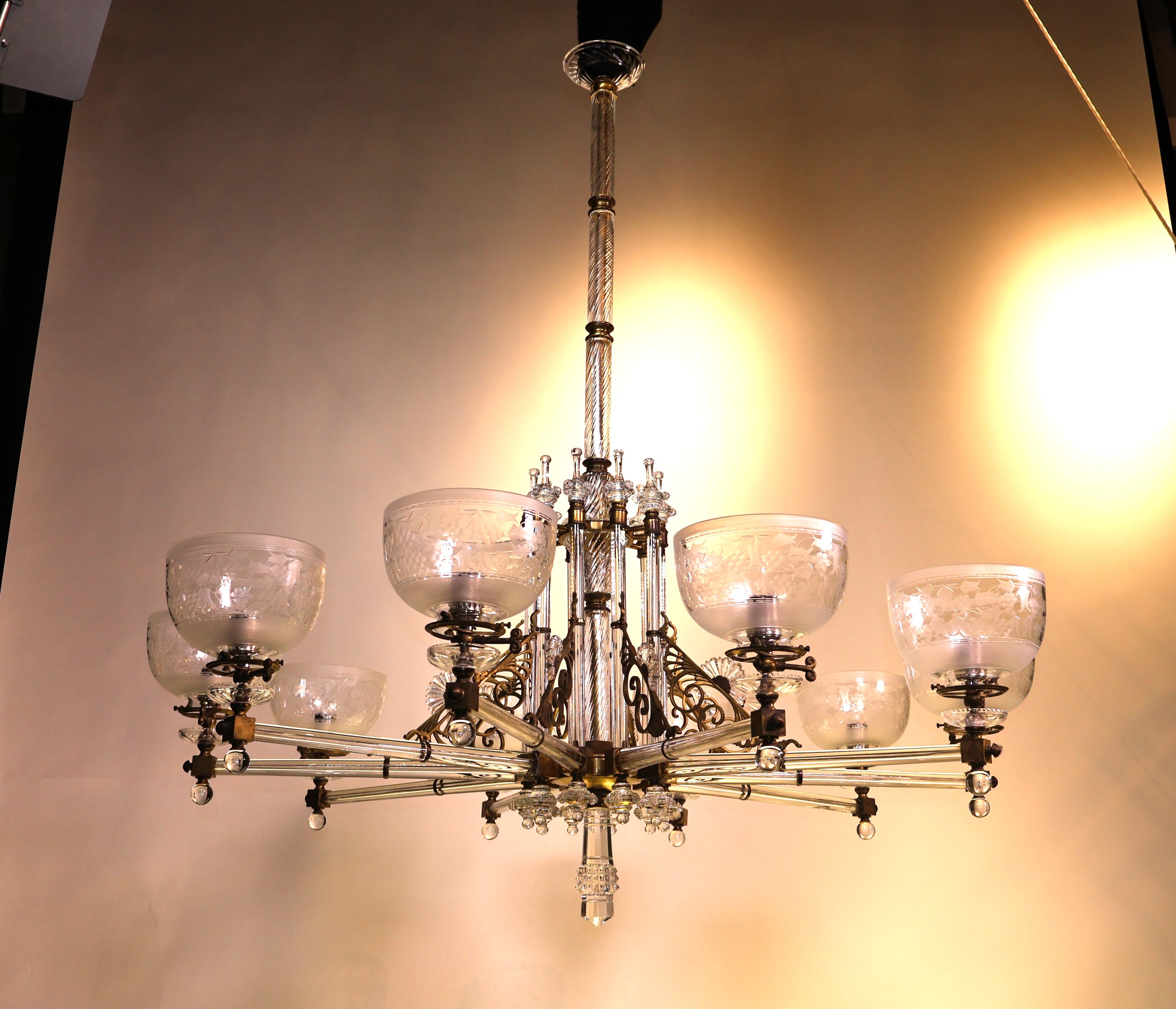 A Fine Bronze & Crystal Chandelier with 10 wheel engraved shades. 
England, circa 1900. 
Dimensions: Height 49 1/2