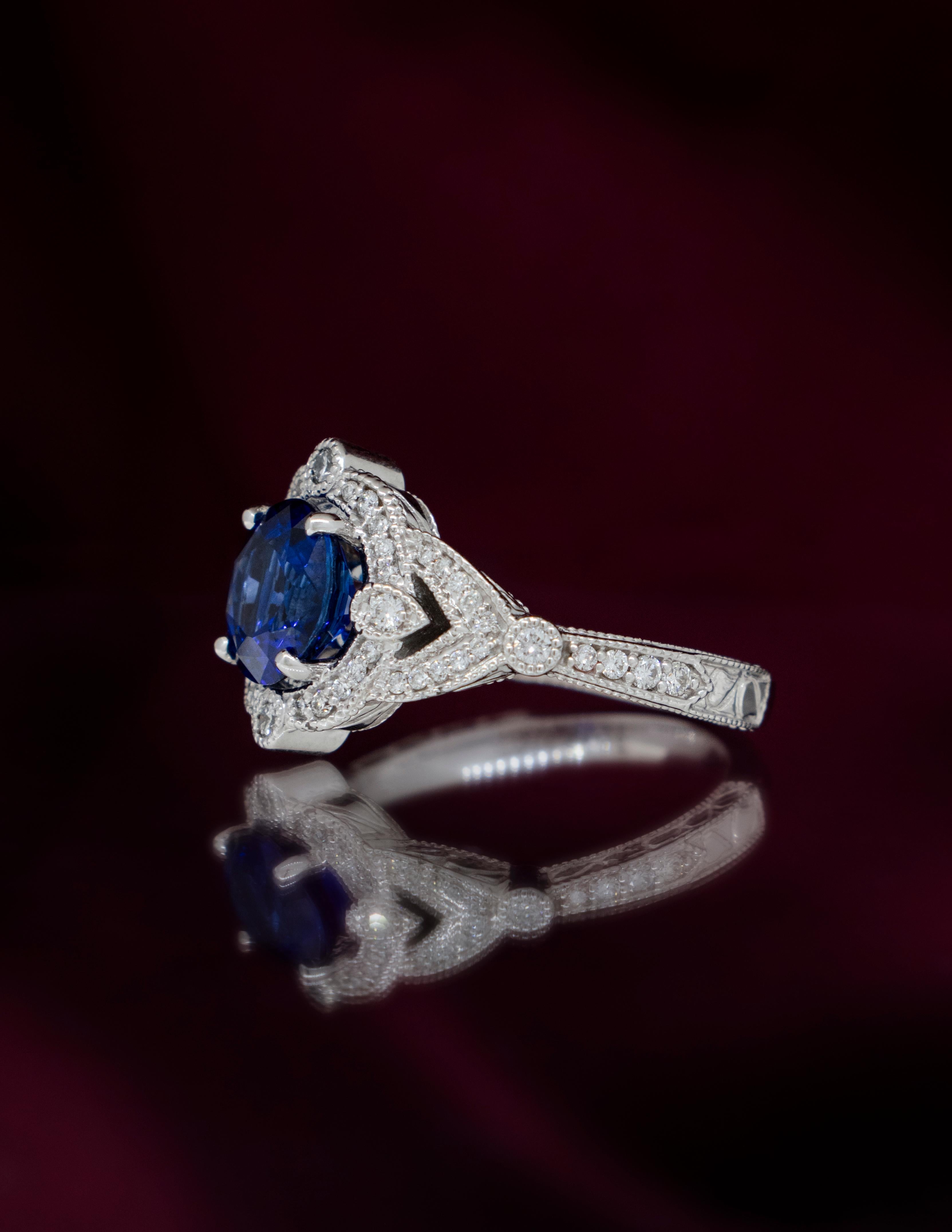 Round Cut A Fine Deep Blue Sapphire in a 14K White Gold Diamond Ring For Sale