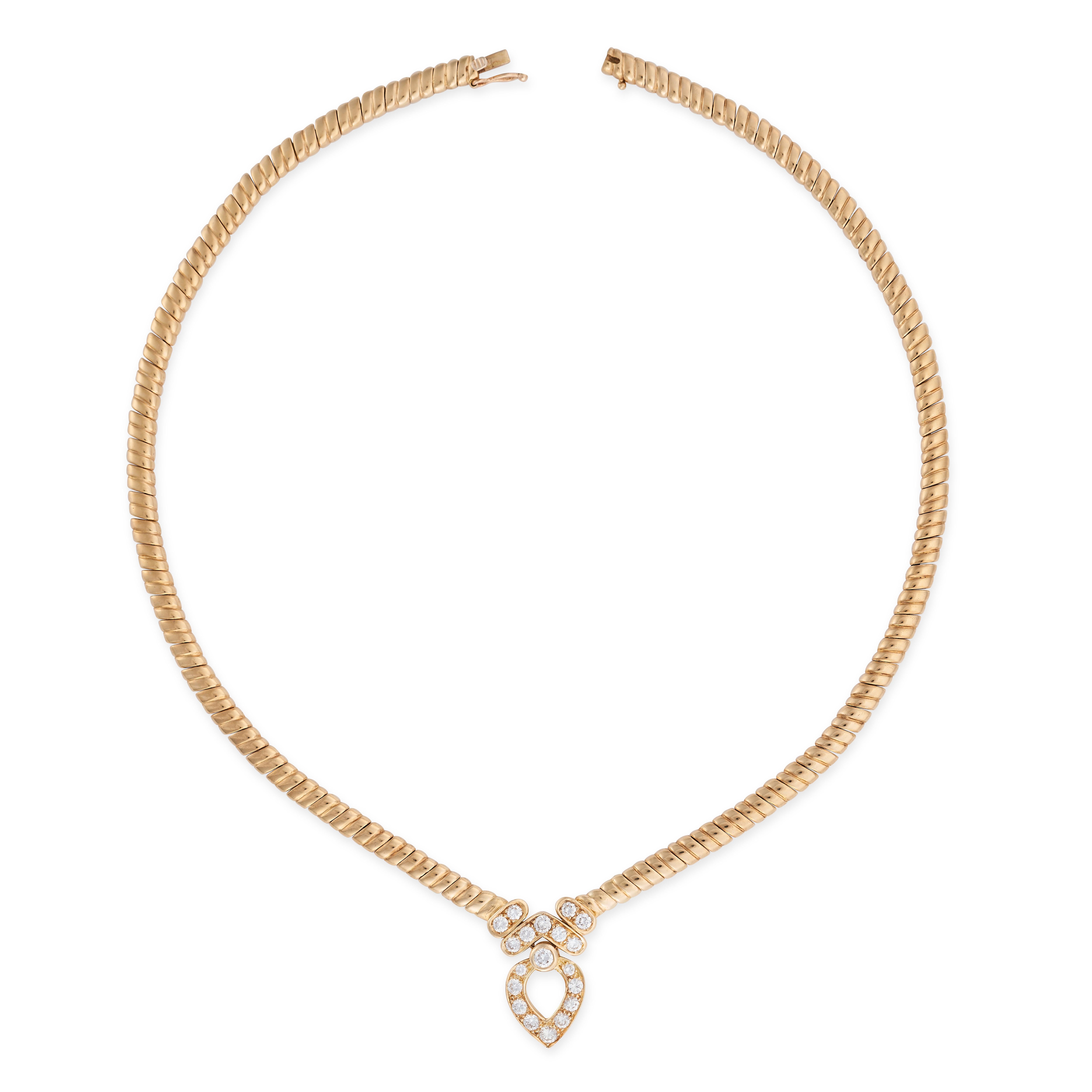 With white, glittering diamonds, this necklace is certainly a showstopper. The 18 carat yellow gold openwork pendant is set with round brilliant cut diamonds befitting of a Van Cleef piece, suspended from a fancy chain.

- Signed Van Cleef & Arpels