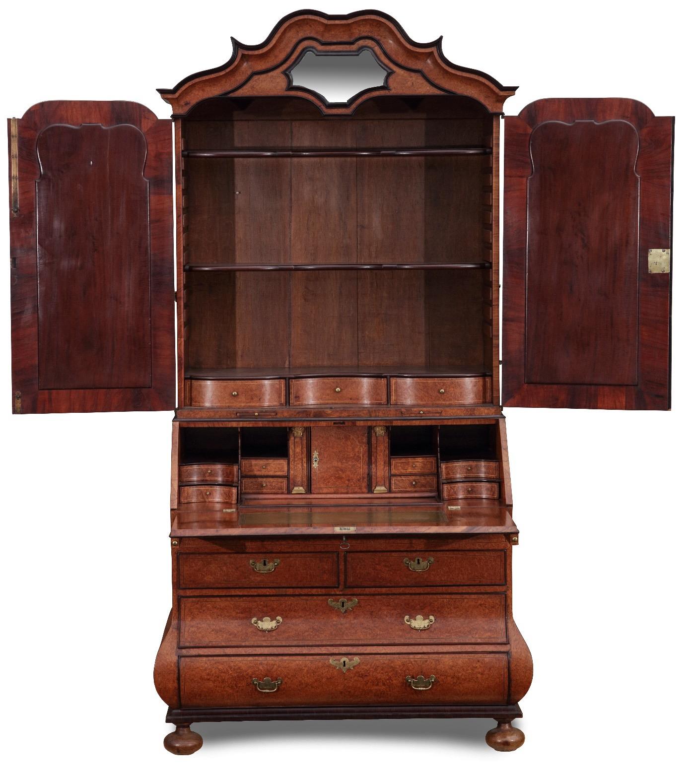 The Hague, circa 1760
Oak, veneered with amboyna root, brass fittings with lacquer gilding.

H: 242 cm. , W: 120 cm. , D: 62 cm.

Provenance: Private collection Germany

The bureau cabinet is a piece of furniture that has become very popular in the